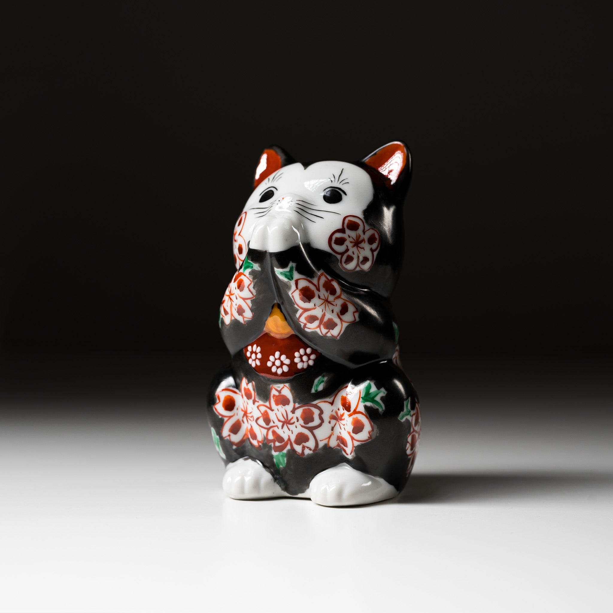 Handmade Kutani Ware Black Flower Begging Cat Ornament 'Sakura' - Japanese Traditional Ceramic Lucky Charm for Home Decor, Office Desk & Gift Giving