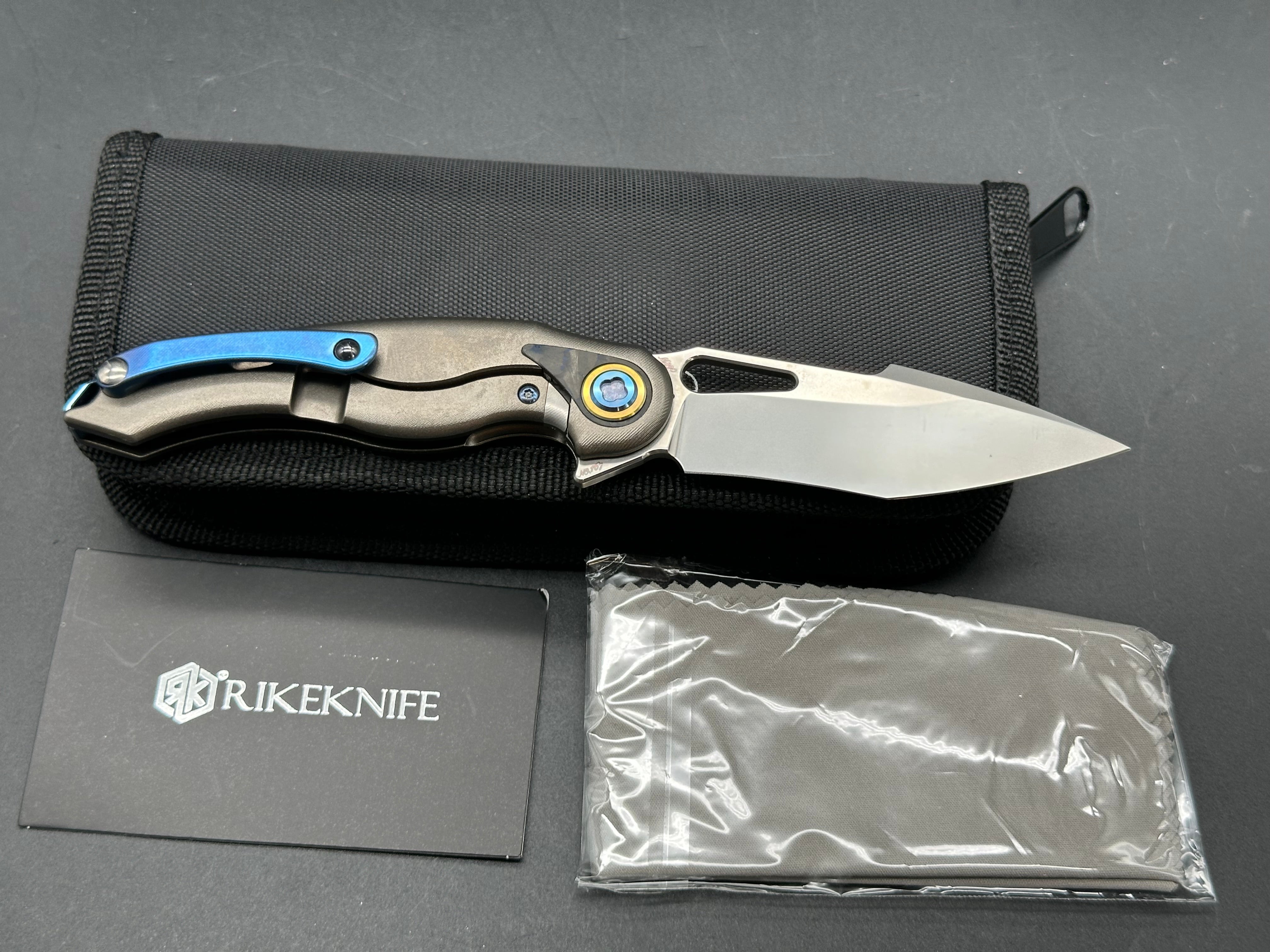 Rike Knife Unicorn Grey Titanium Frame with Marble Carbon Fiber Inlay Satin M390 Blade - Premium EDC Folding Knife for Outdoor Camping, Hiking & Survival