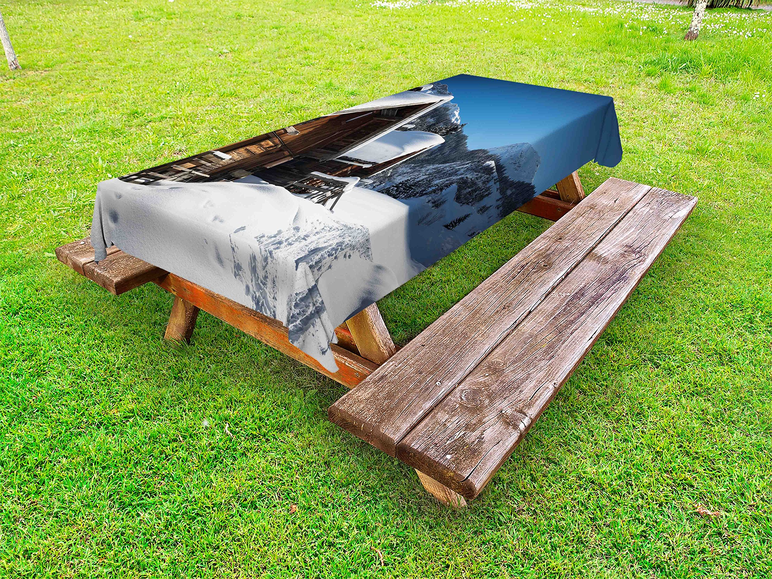 Ambesonne Winter Outdoor Tablecloth – Snowy Forest Cottage Holiday Design with Wooden Houses on Austrian Mountains, Washable Picnic Table Cover, 58