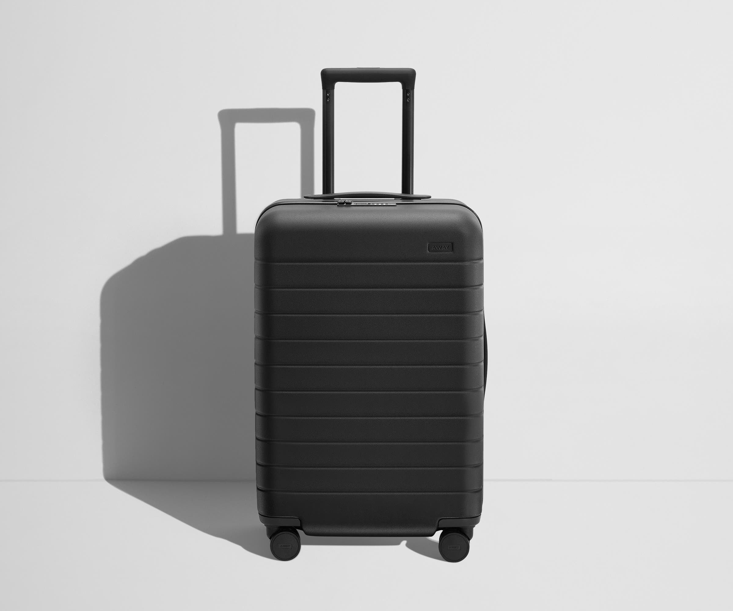 The Bigger Carry On Flex Suitcase - Jet Black Expandable Luggage for Travel & Business Trips | Lightweight & Durable Spinner Bag