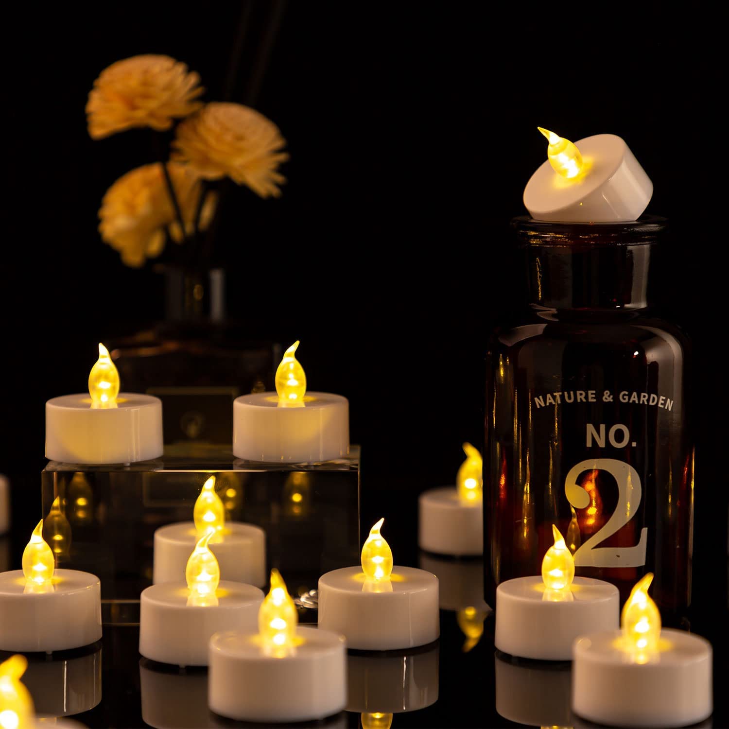 Hanzim 50-Pack LED Tea Light Candles - 100 Hours Battery Operated Flameless Candles with Realistic Flickering Effect, Warm White for Wedding, Party, Halloween, Christmas Decorations & Home Ambiance Lighting