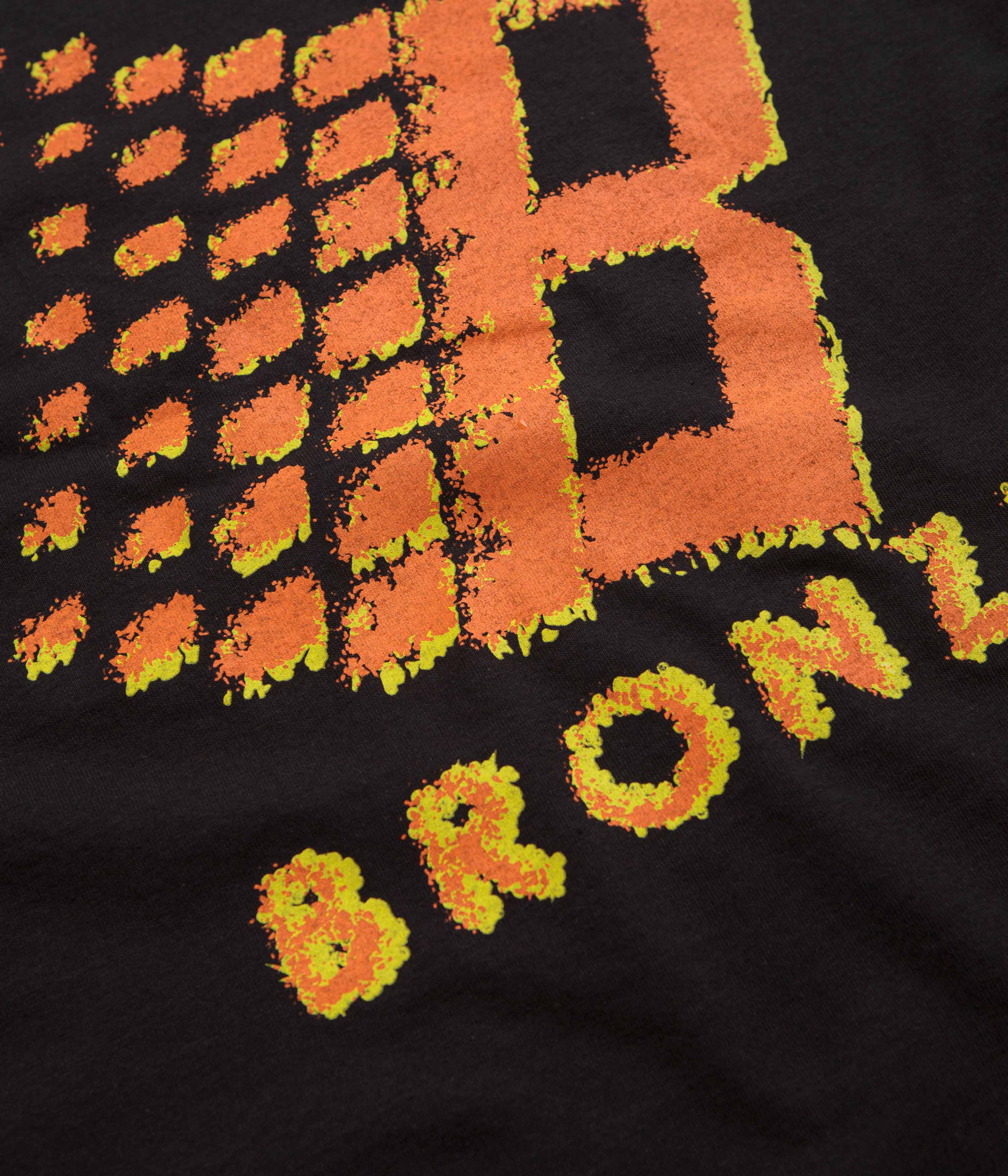 Bronze 56K B Logo Graphic T-Shirt - Black & Orange Vintage Style Tee for Men | Casual Streetwear, Music Festival Outfit, Retro Fashion Statement
