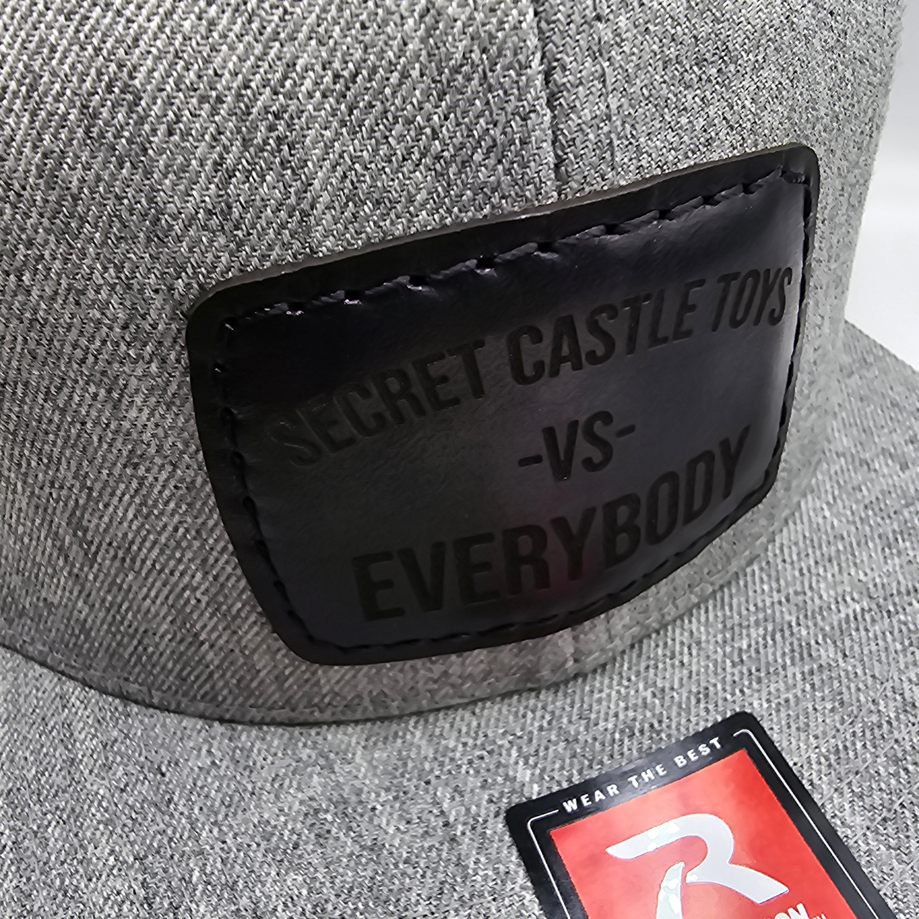 Ash/Black Secret Castle VS Everybody Black Patch Mesh Trucker Cap - Stylish Adjustable Hat for Men & Women, Perfect for Outdoor Activities, Concerts, and Streetwear Fashion