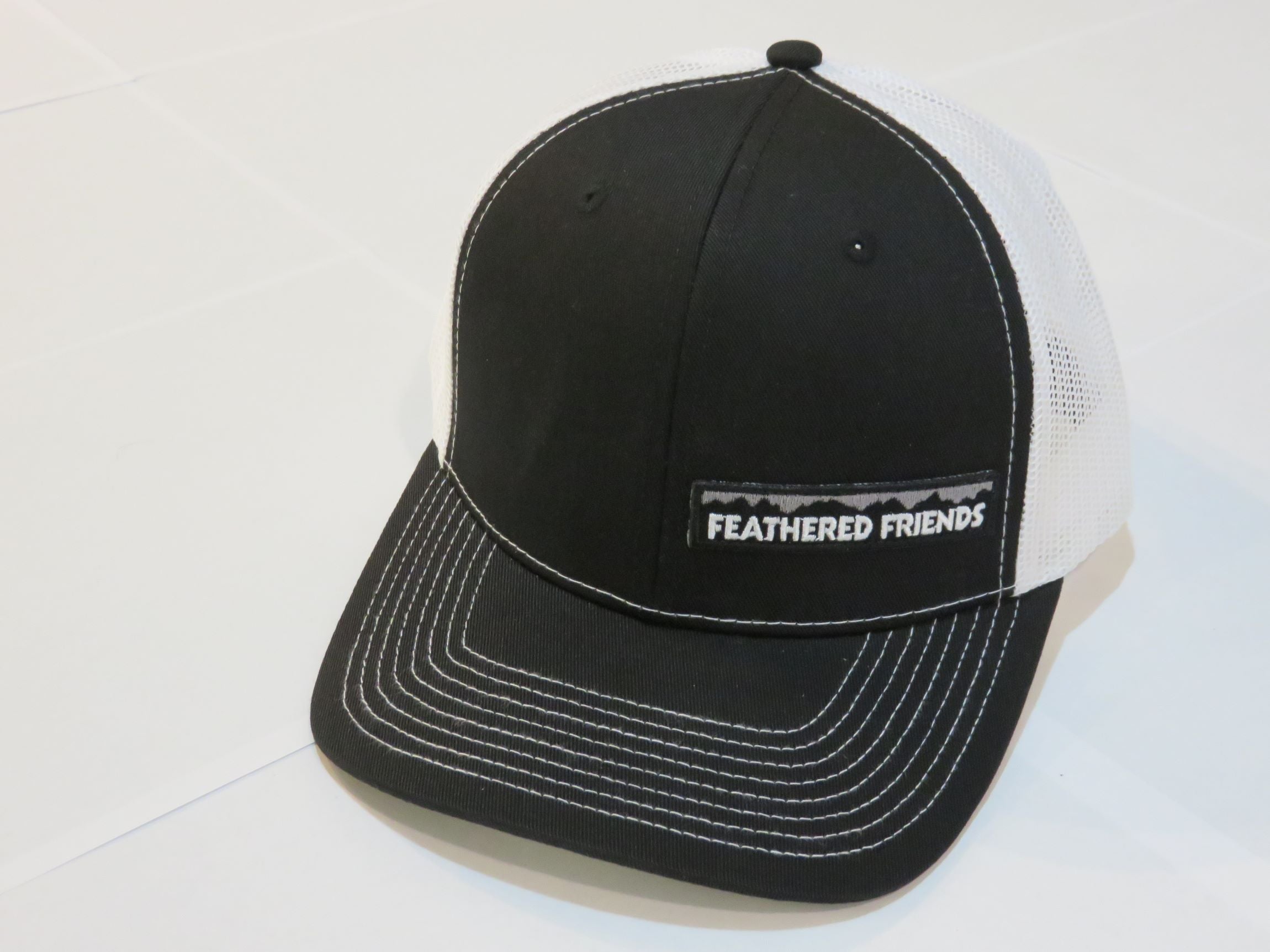 Feathered Friends Pro Style Trucker Offset Mountain Logo Patch Hat - Stylish Adjustable Cap for Outdoor Adventures, Hiking & Casual Wear