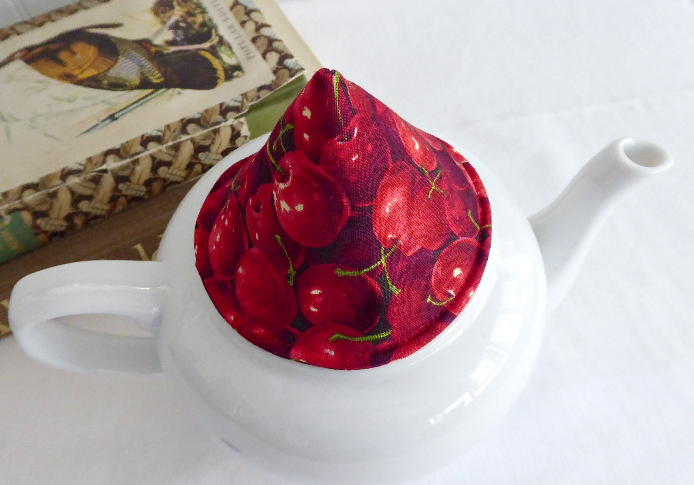 Red Cherries Knob Holder - Teapot Lid Holder with Soft Padded Interior & Exterior - Perfect for Kitchen, Tea Parties, and Gift Giving