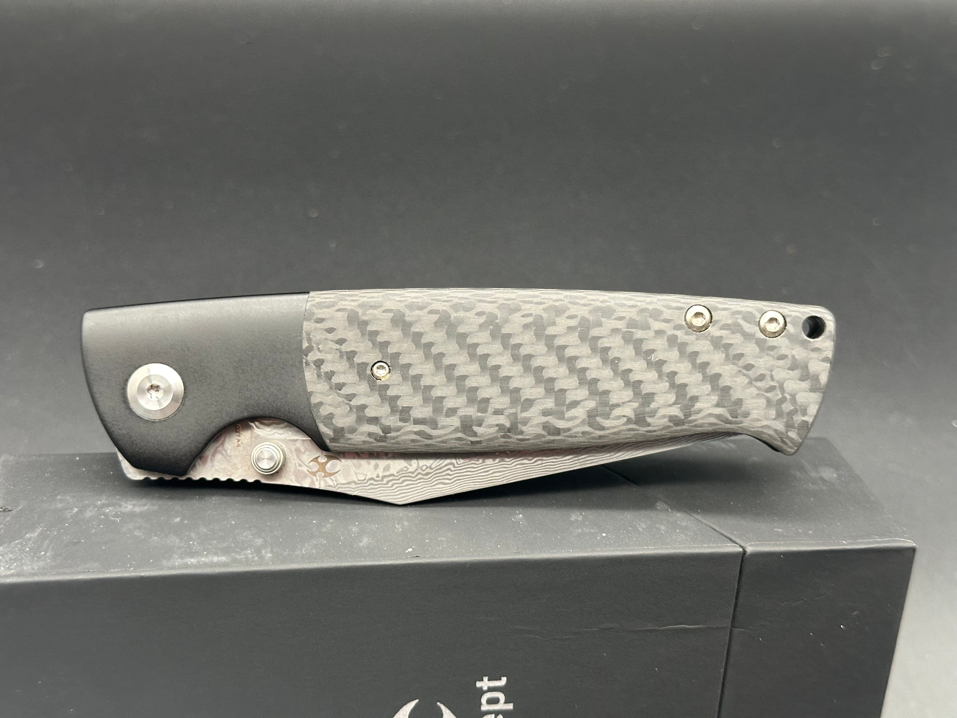KANSEPT SHIKARI Folding Knife - Black Titanium Handle with Twill Carbon Fiber Inlay & Damascus Steel Blade - Plain Edge for Outdoor, Camping, and EDC Use