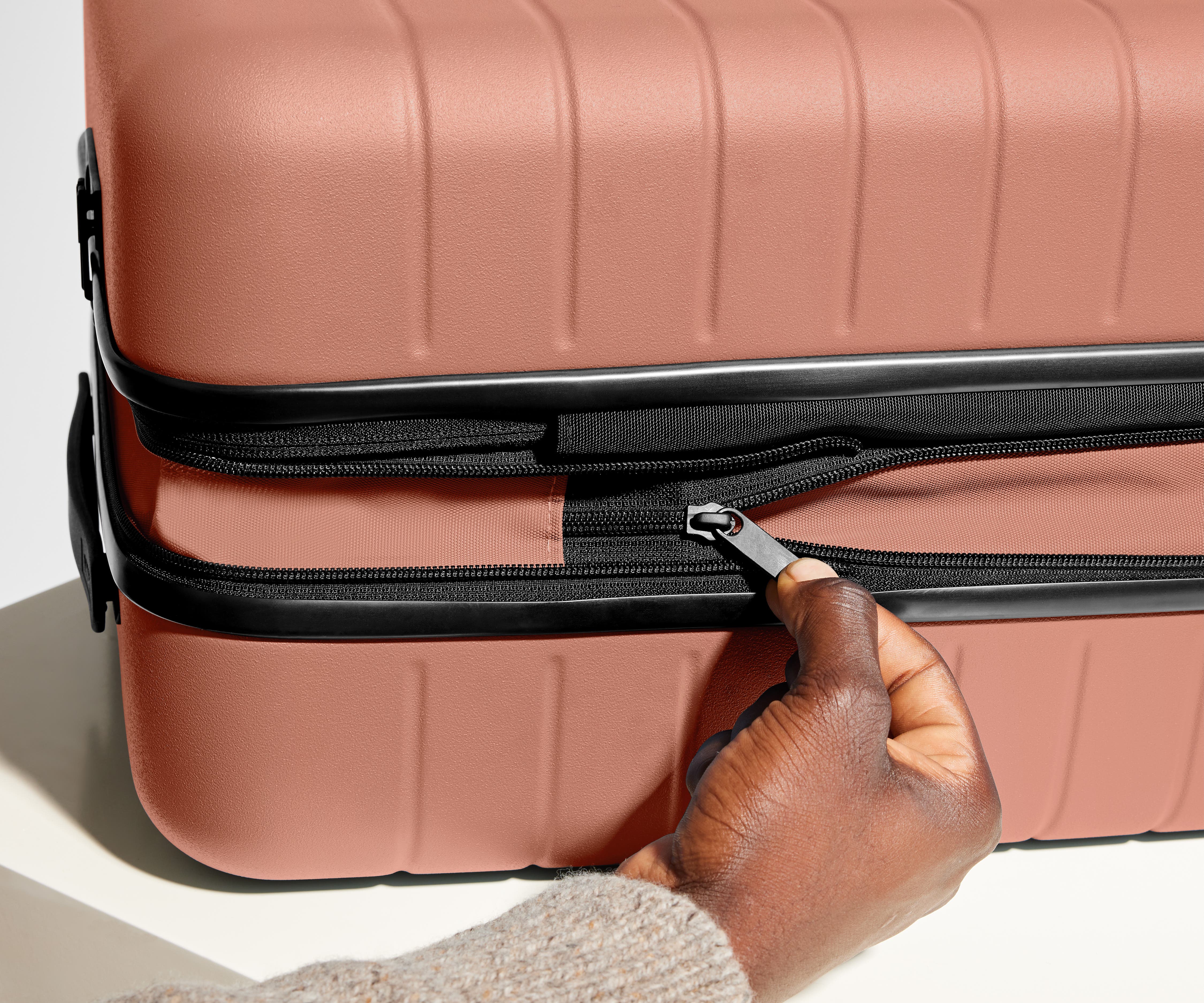 The Carry On Flex in Clay Pink - Lightweight Expandable Luggage for Travel, Business Trips & Weekend Getaways