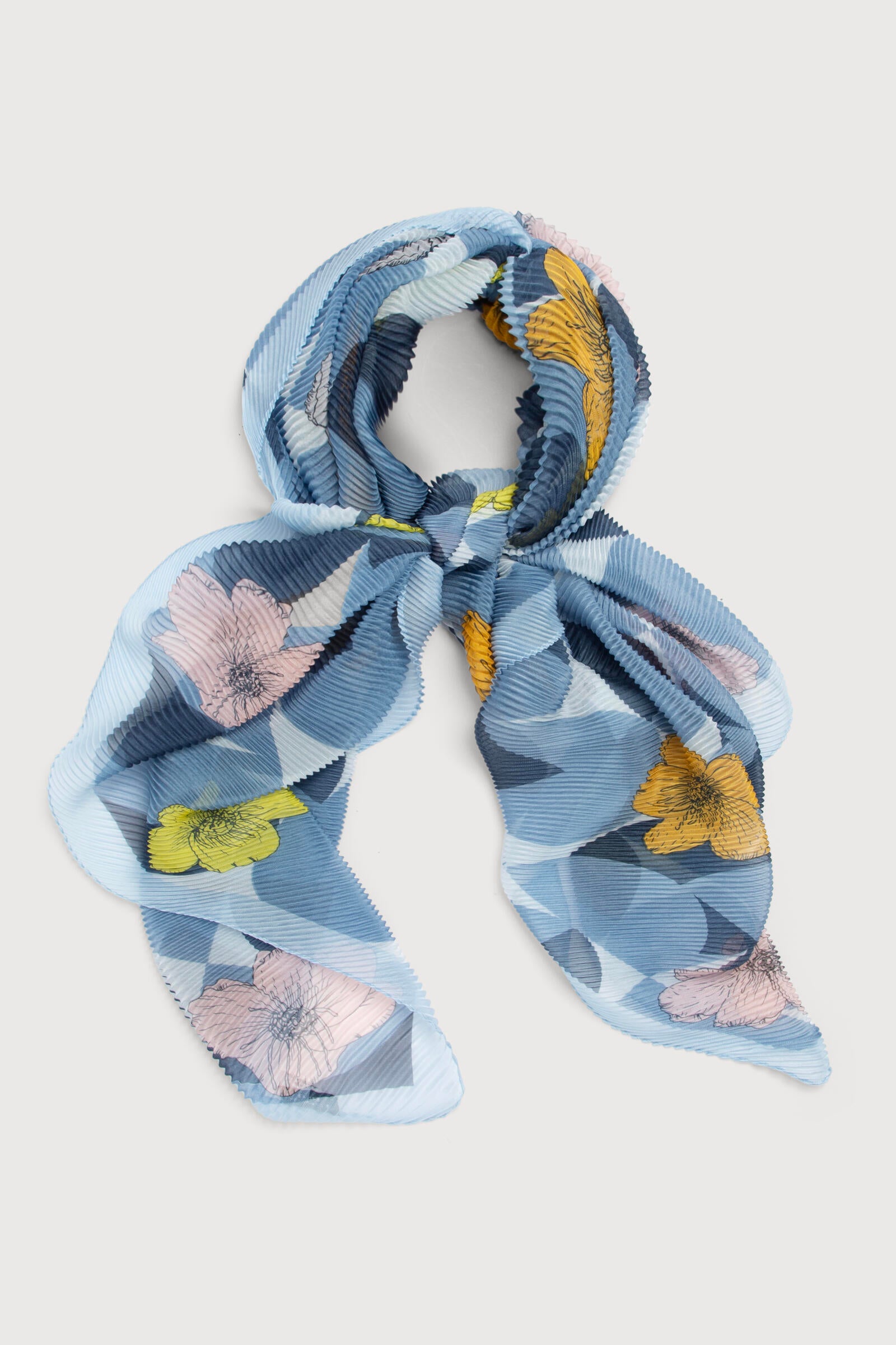 The Floral Geo Pleated Scarf: A Tale of Elegance and Adventure