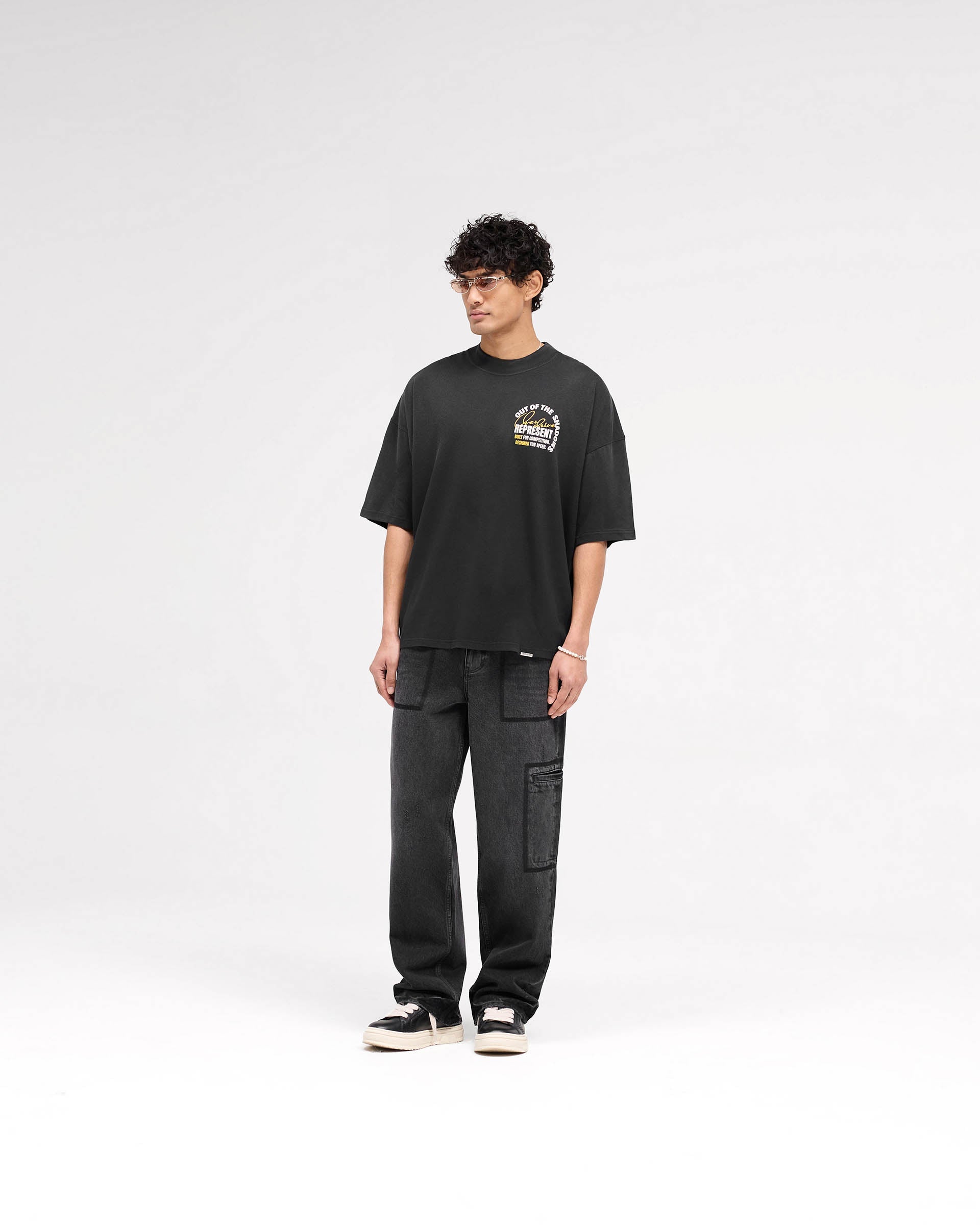 Out Of The Shadows T-Shirt - Premium Stained Black Graphic Tee for Men | Trendy Streetwear & Casual Outfit Essential