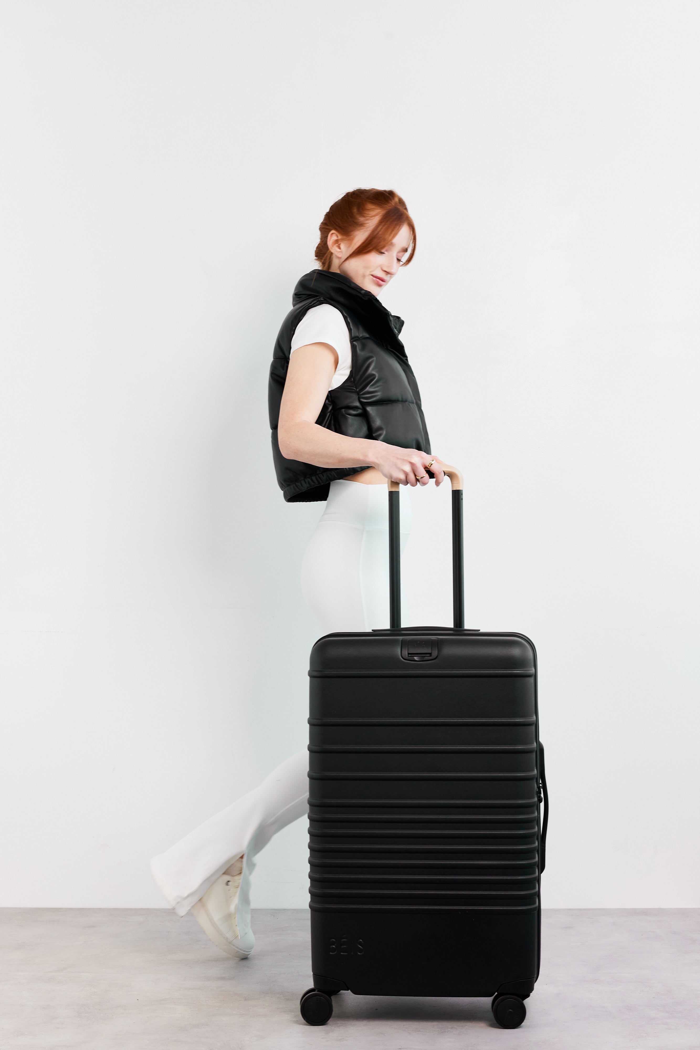 Black The Medium Check-In Roller Luggage - Perfect for Air Travel & Business Trips