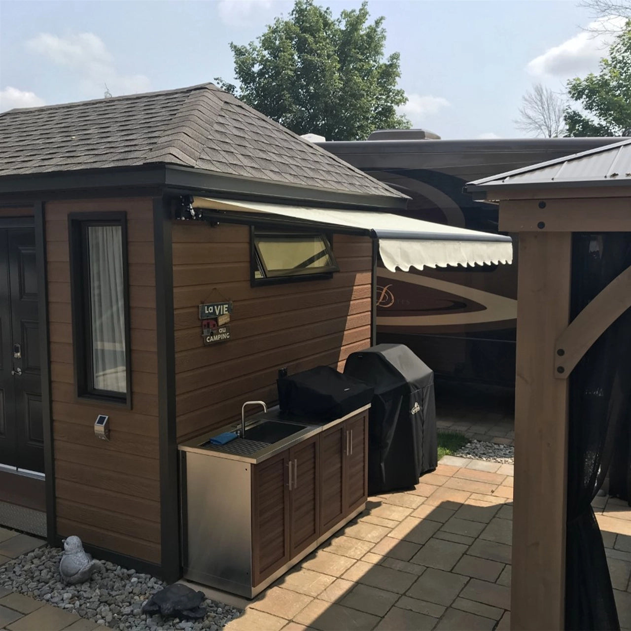 Aleko 20x10 Feet Motorized Retractable Patio Awning with Black Frame in Ivory - Perfect for Outdoor Shade, Backyard Relaxation, and Deck Protection