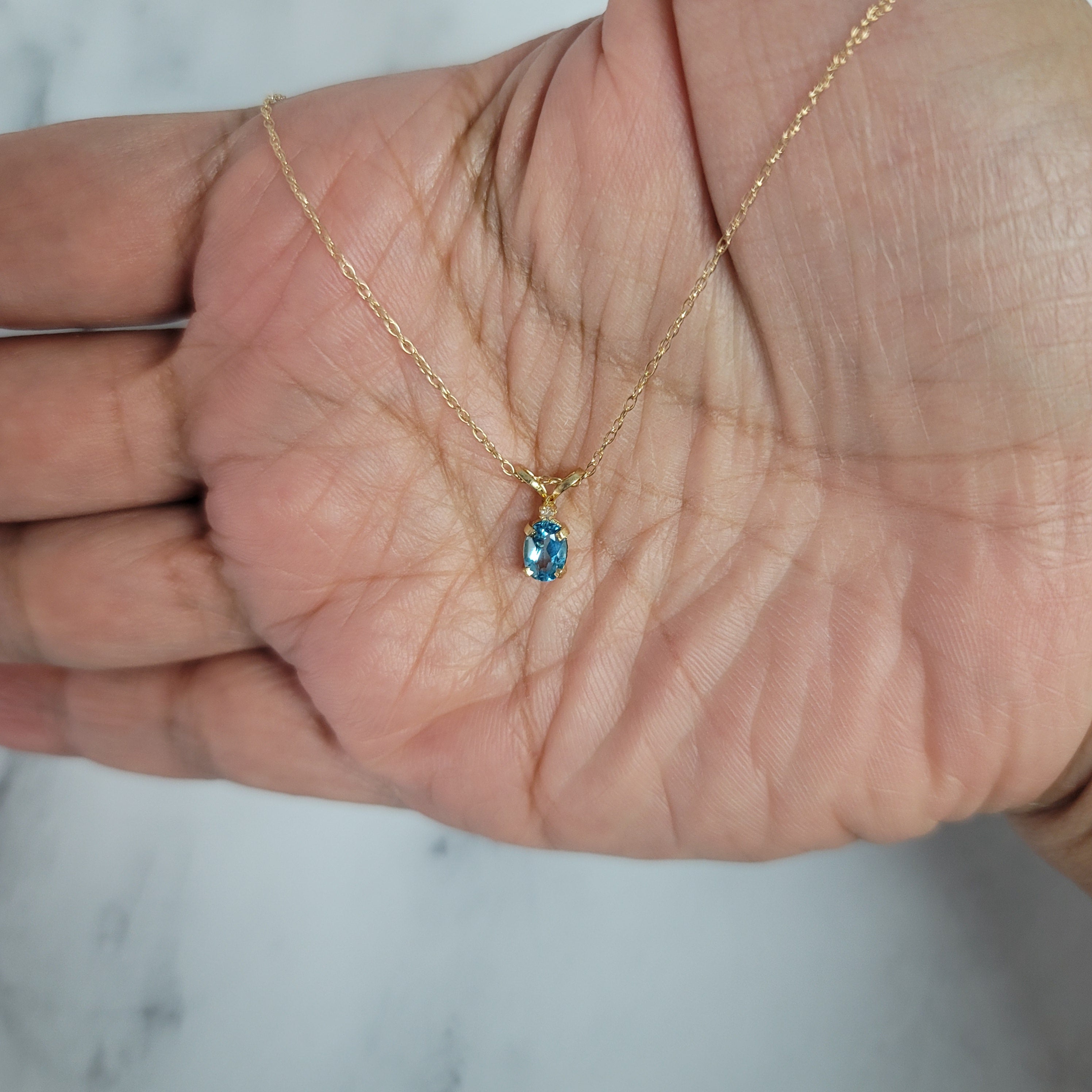 14K Yellow Gold Solitaire Oval Blue Topaz Ring - 0.25cttw Elegant Jewelry for Women, Perfect for Engagement, Anniversary & Special Occasions