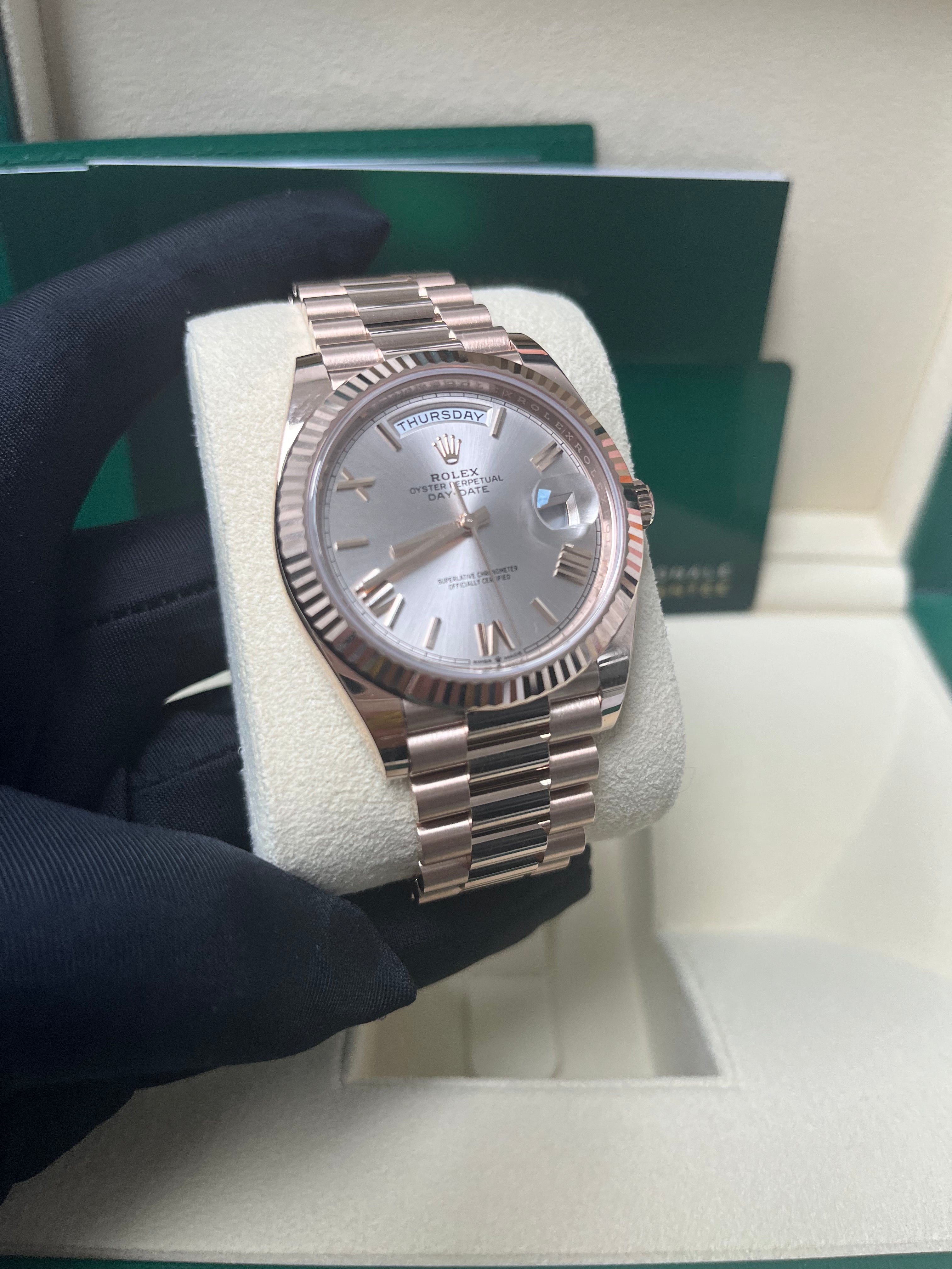 Rolex Day Date 40mm Rose Gold Watch with Sundust Roman Dial & Fluted Bezel (Ref #228235) - Luxury Dress Watch for Business & Formal Occasions