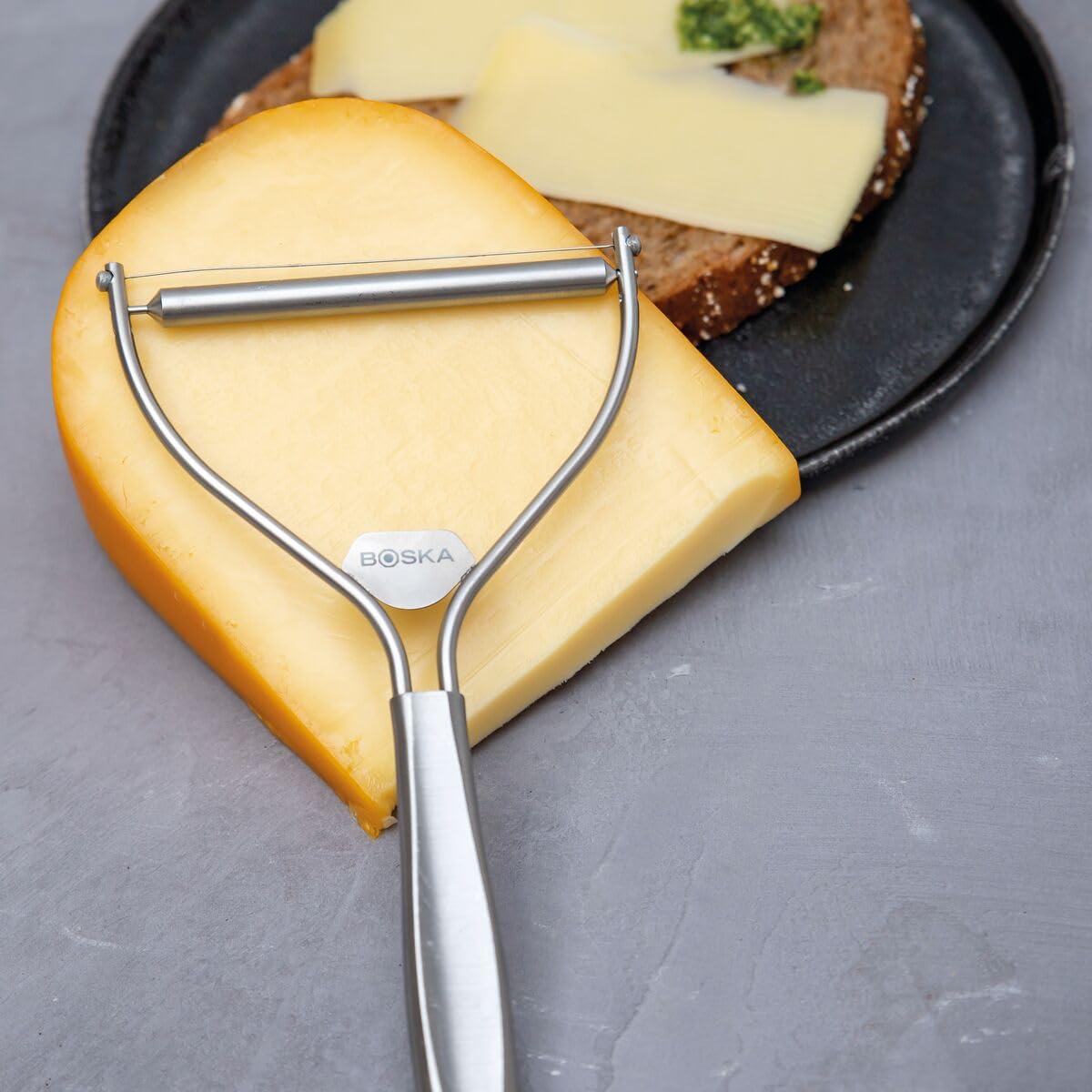 Boska Monaco Cheese Slicer with Wire - Premium Handheld Cheese Cutter for Hard & Soft Cheeses - Non-Stick Silver Blade with 3 Replacement Wires - Dishwasher Safe Kitchen Tool - Perfect for Entertaining, Charcuterie Boards & Gourmet Cooking