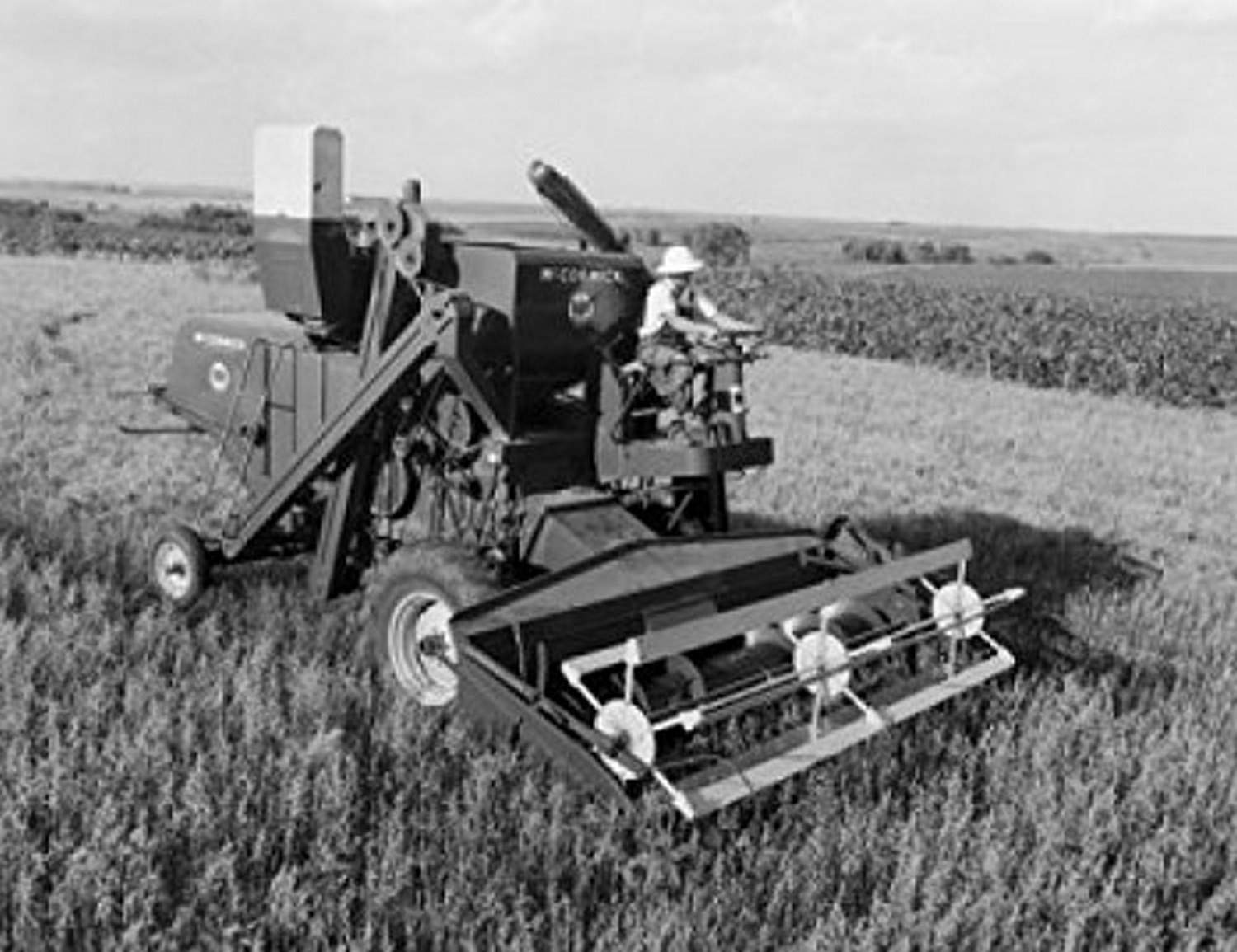 Vintage Farmer Harvesting Oats with Combine in Field - 18x24 Inch Farmhouse Wall Art Poster | Perfect for Country Kitchen, Farmhouse Decor & Agricultural Office