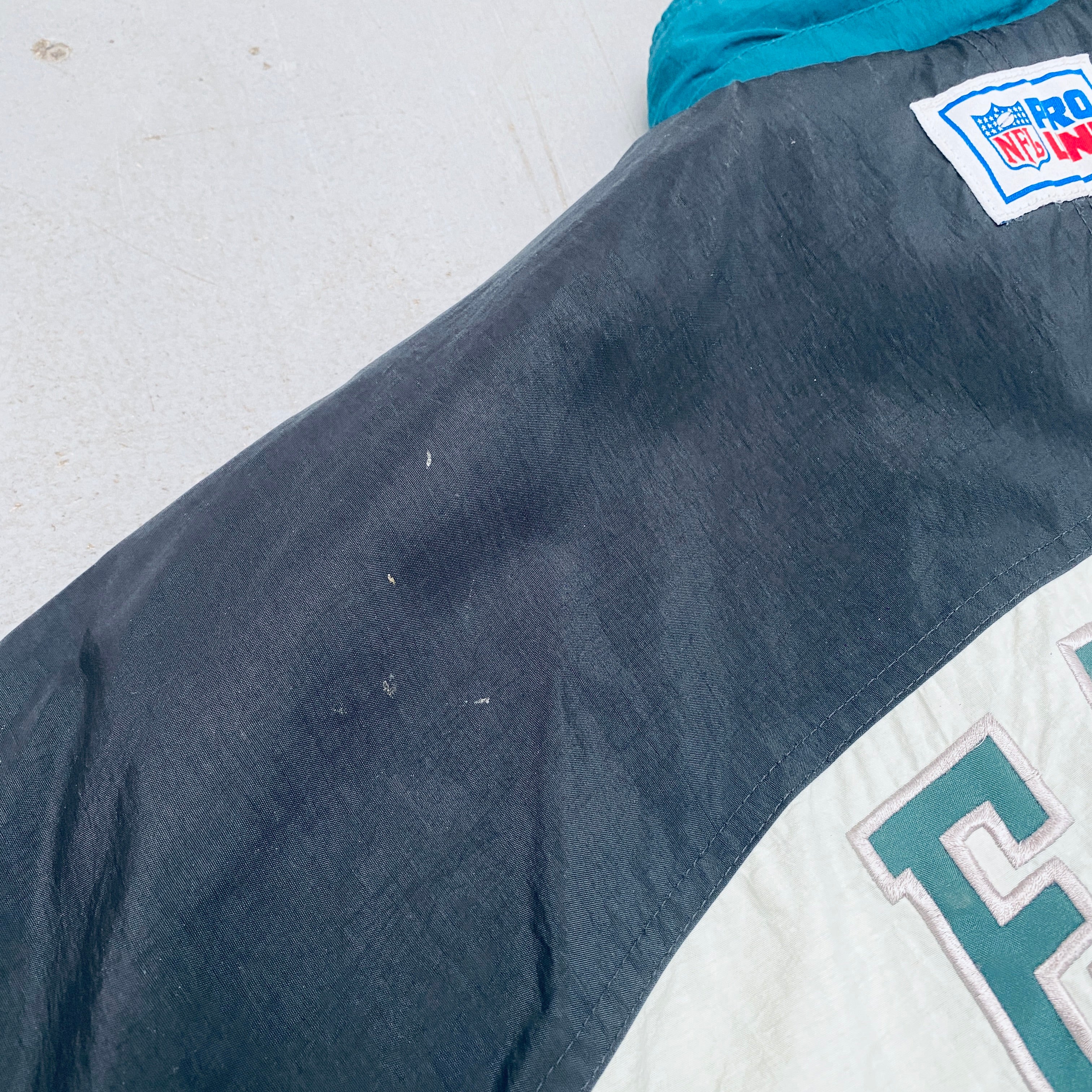 Philadelphia Eagles 1990s Reebok Reverse Spellout Full-Zip Proline Jacket for Men - Vintage NFL Football Fan Gear for Game Day & Casual Wear