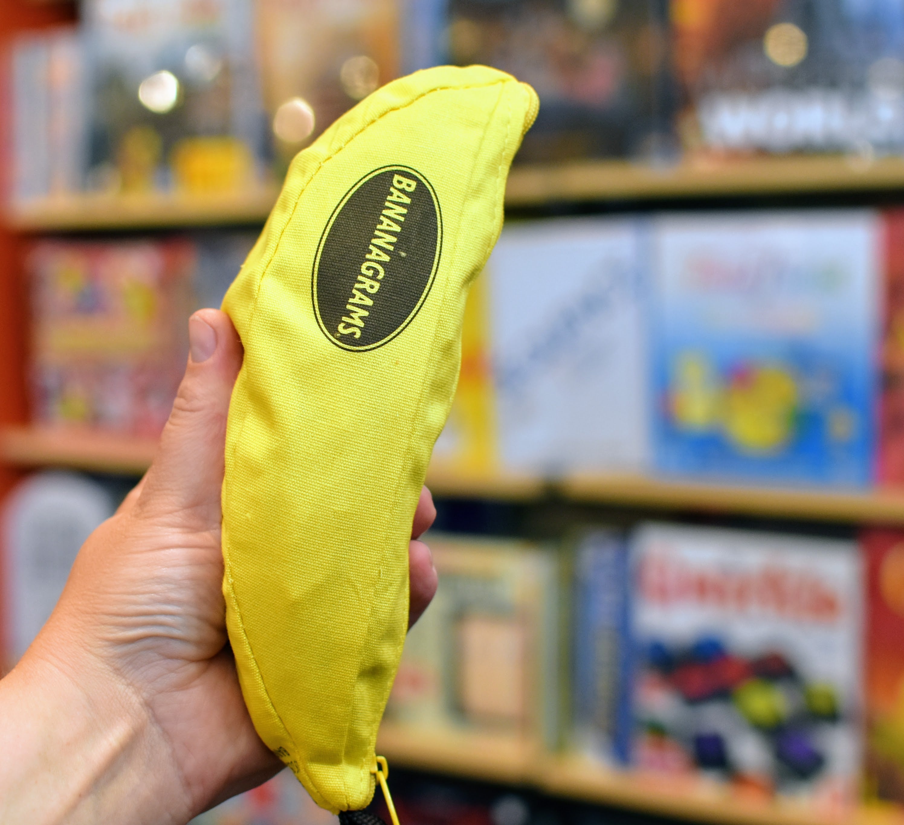Bananagrams Word Game - Fast-Paced Family Board Game for Kids & Adults - Travel-Friendly in Bag - Perfect for Parties, Road Trips & Educational Fun