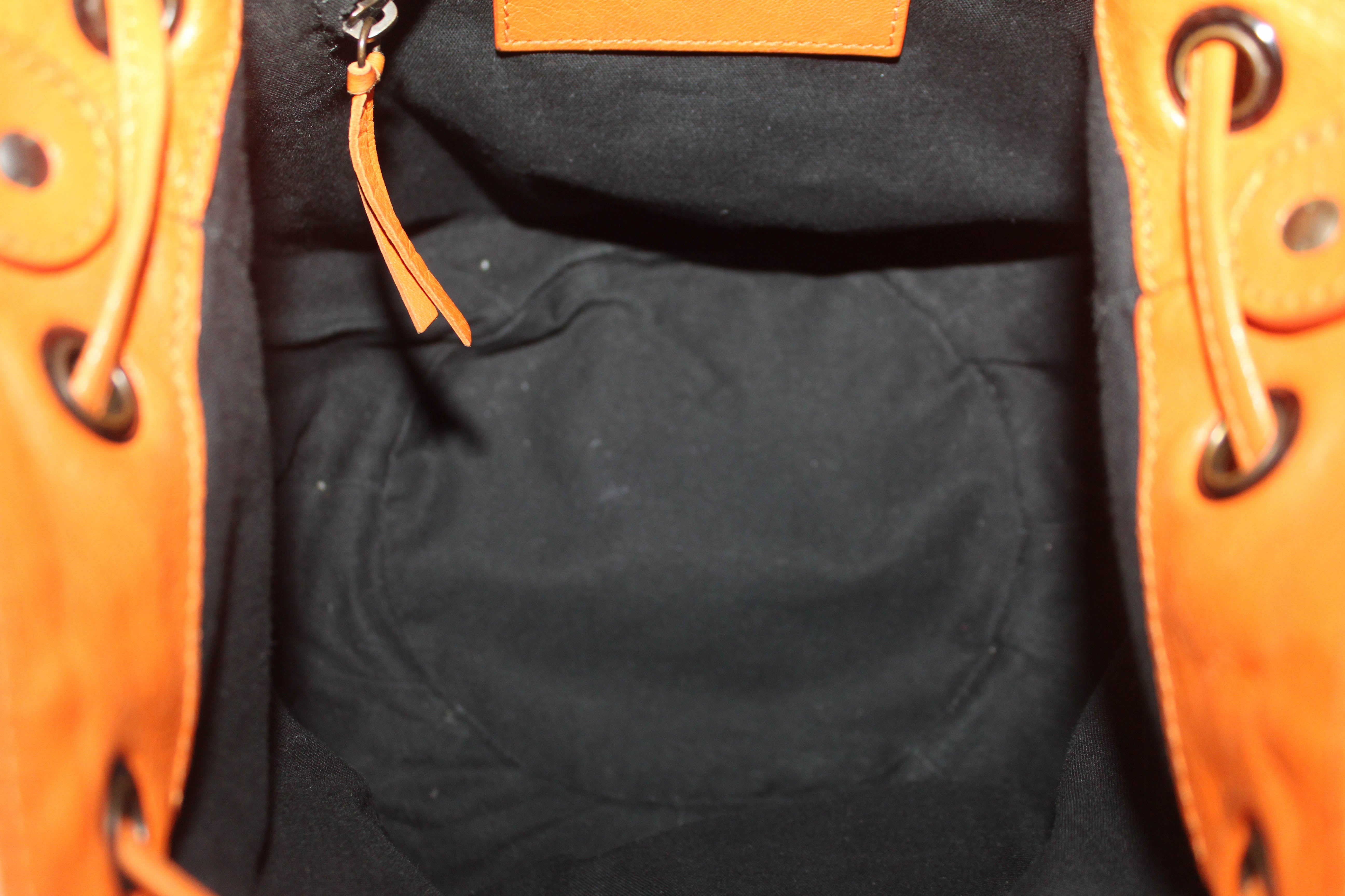 Authentic Balenciaga Orange Lambskin Leather Mini Pompon Bucket Crossbody Bag for Women - Luxury Designer Handbag for Party, Date Night & Everyday Use