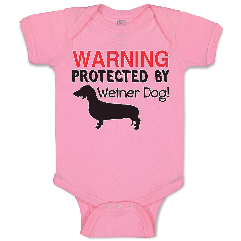 Funny Baby Bodysuit with 'Protected by Weiner Dog' Design - Soft Cotton Pink Newborn Onesie for Boys & Girls | Perfect for Playtime, Photo Shoots & Everyday Wear
