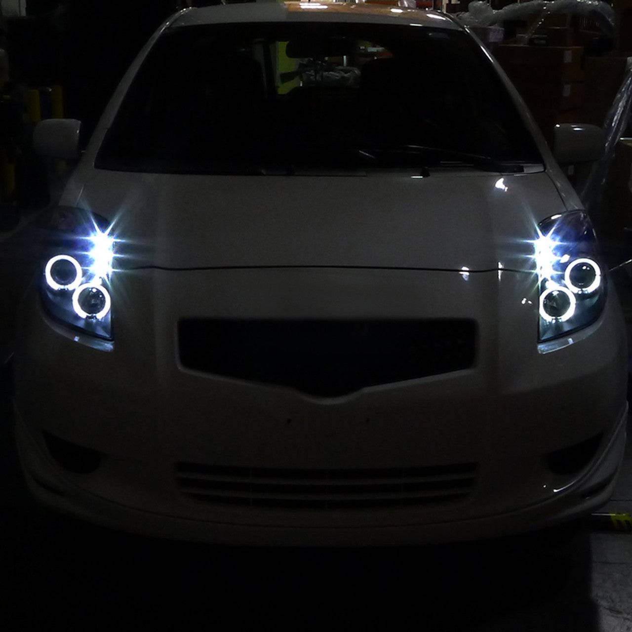 2006-2008 Toyota Yaris Halo Projector Headlights - Matte Black Housing with Clear Lens - LED Angel Eye Headlight Assembly for Night Driving & Car Customization