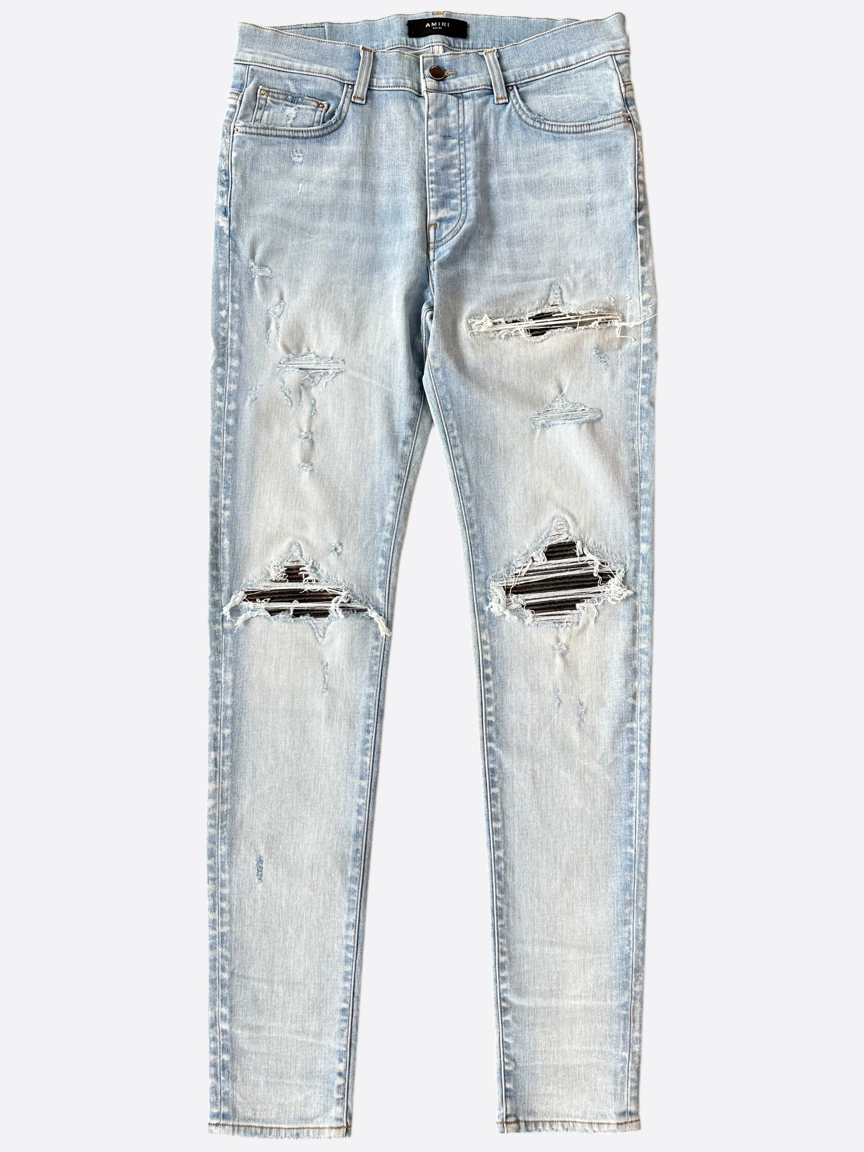Amiri Light Indigo Camouflage Patch MX1 Jeans for Men - Premium Distressed Denim Pants with Camo Details | Perfect for Streetwear & Casual Outfits