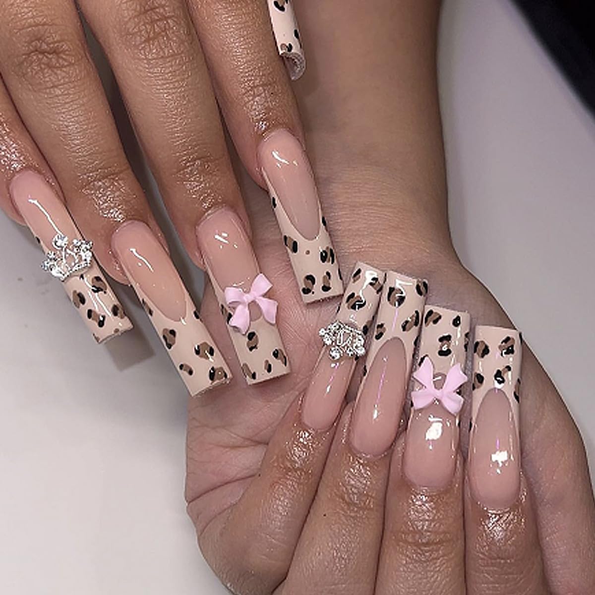 French Tip Leopard Print Press on Nails - Long Coffin Fake Nails with 3D Resin Bow & Rhinestone Designs - Glossy Nude Pink Full Cover Acrylic Stick on Nails for Women - 24Pcs - Perfect for Parties, Weddings & Special Occasions