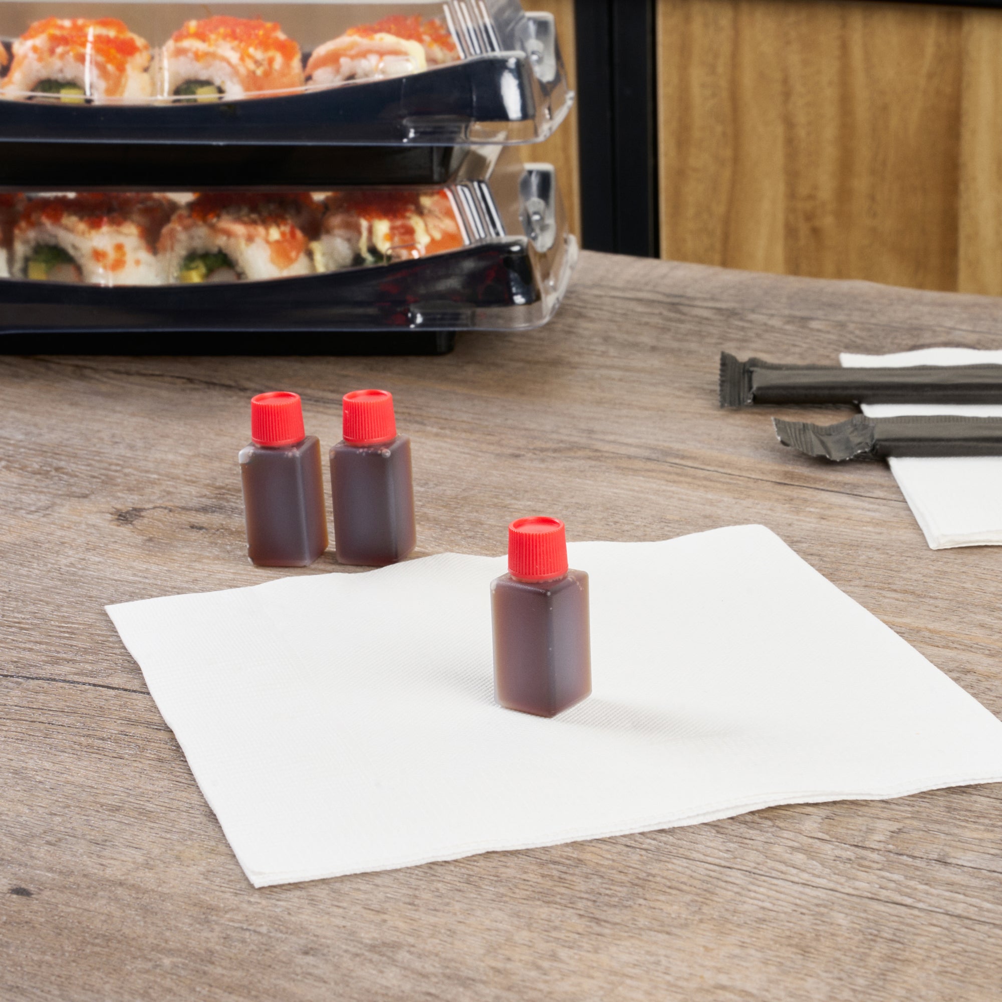 Bento Tek 6mL Clear Plastic Soy Sauce Bottles with Red Caps - 1/2