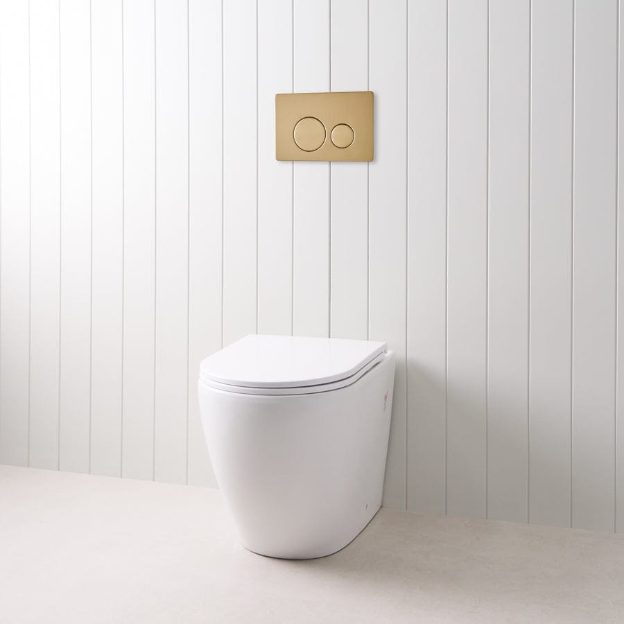 Curved In-Wall Toilet with Round Warm Brushed Nickel Buttons - Modern Space-Saving Bathroom Solution for Small Homes & Luxury Apartments
