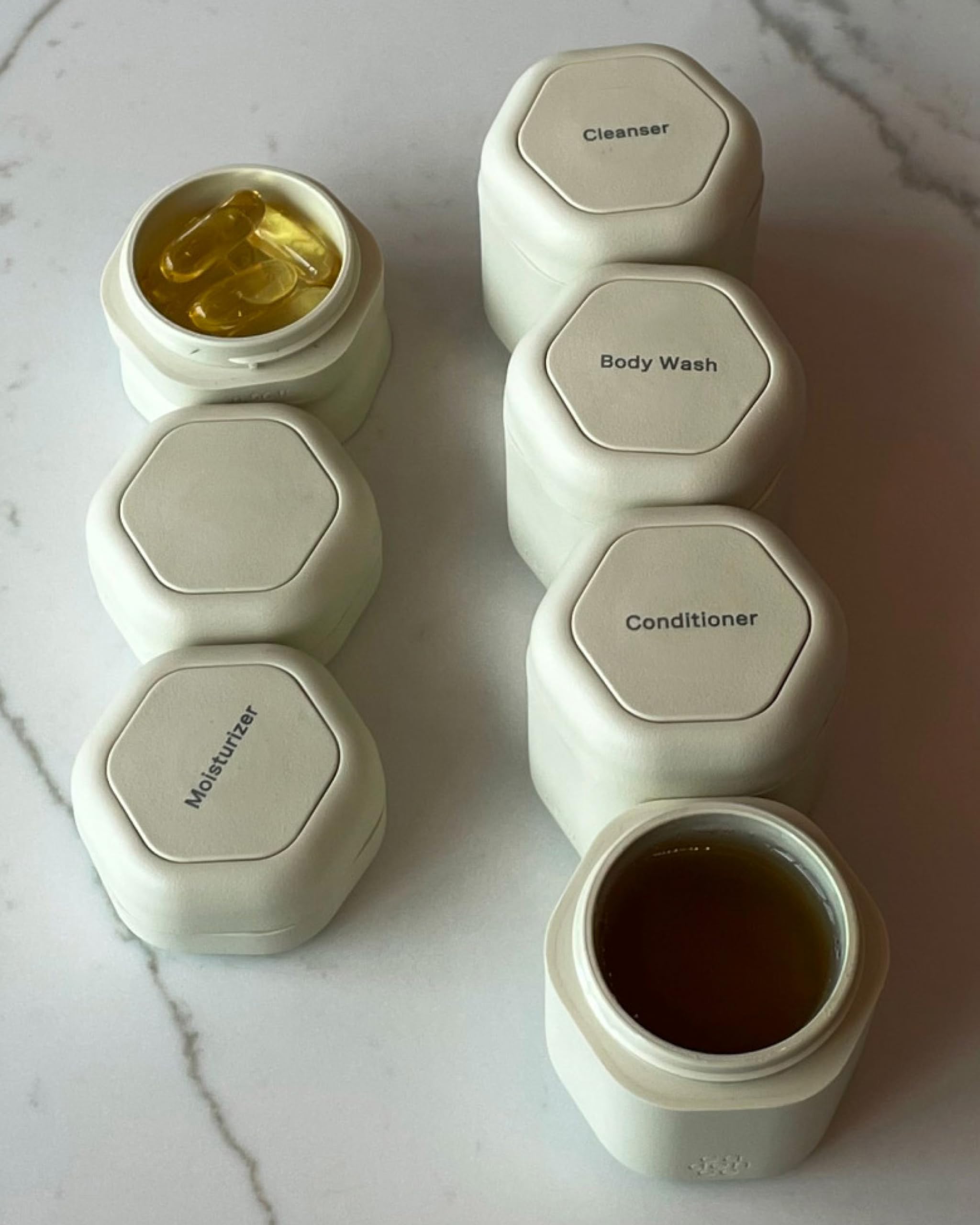 Cadence Travel Containers - Magnetic Leakproof Capsule Set for Shampoo, Conditioner, Body Wash & Pills - 4 Medium (1.32oz) & 3 Small (0.56oz) Flex Containers - Sand Color - Perfect for Gym, Travel & Daily Essentials Organization