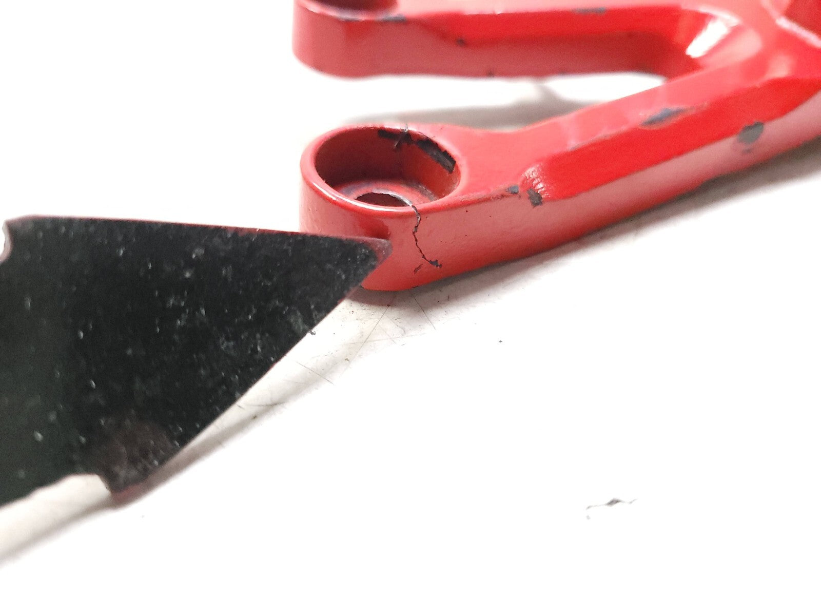 04-05 Honda CBR1000RR Foot Peg Bracket Left Side OEM Replacement Part - Perfect for Motorcycle Repair & Racing Upgrades