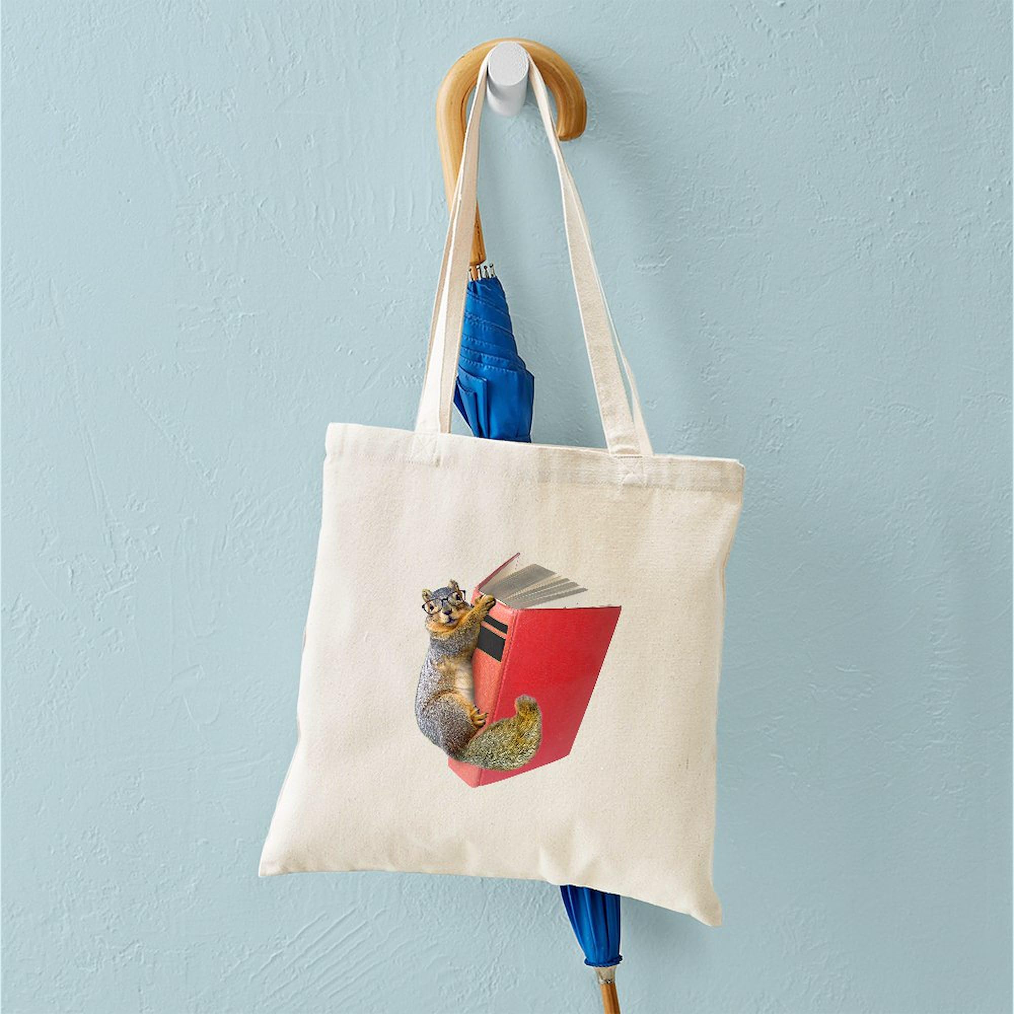 Eco-Friendly Squirrel on Book Canvas Tote Bag - Natural Reusable Shopping Bag for Groceries, Beach & Library | CafePress