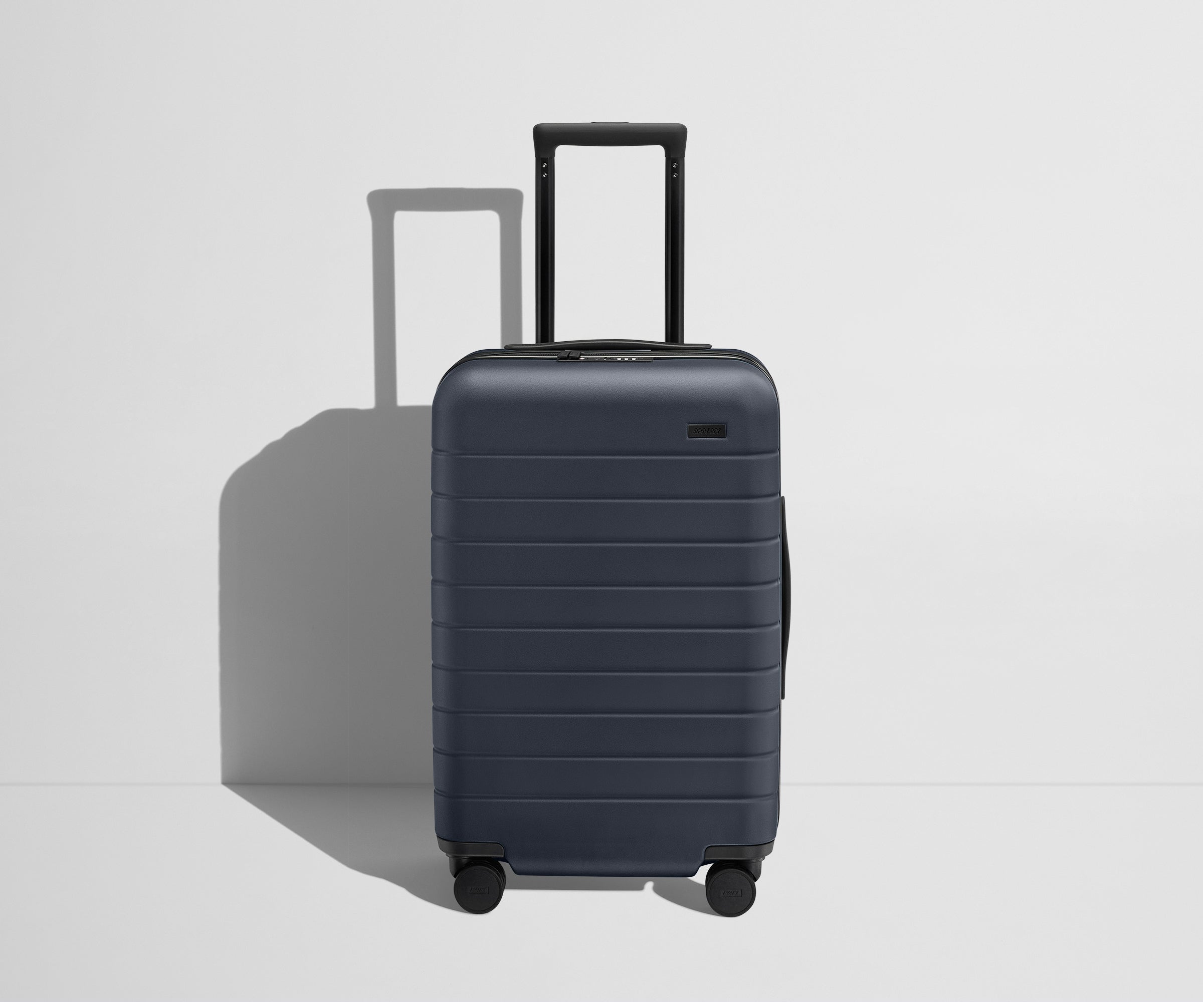 The Carry On Flex in Navy Blue - Lightweight Expandable Luggage for Travel - Perfect for Airplane, Business Trips & Weekend Getaways