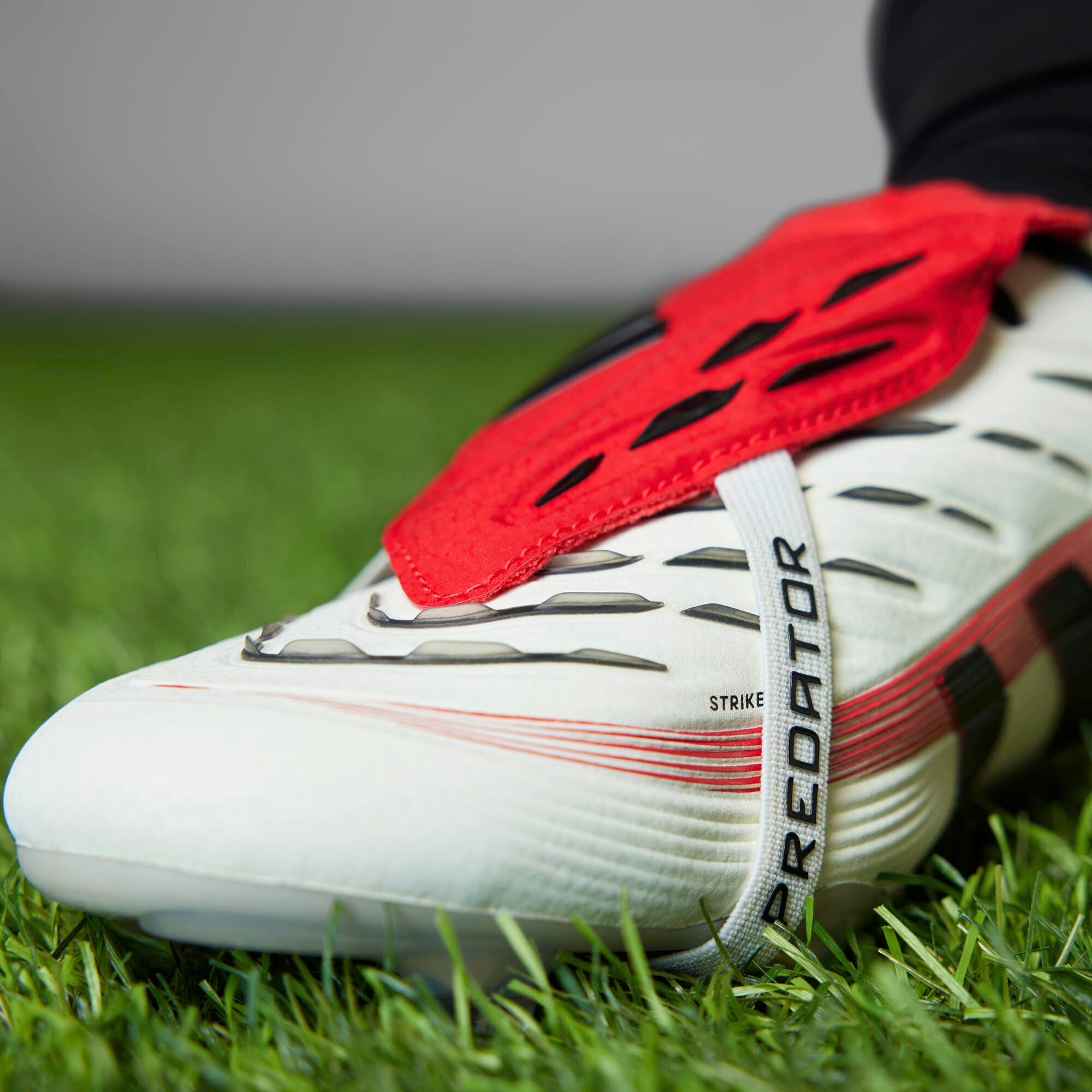 **adidas Predator Elite Fold Over Tongue Soccer Cleats - Lightweight & Comfortable for Football Training & Matches**    *(Use Case: Perfect for competitive soccer players seeking superior traction and support on firm ground surfaces.)*