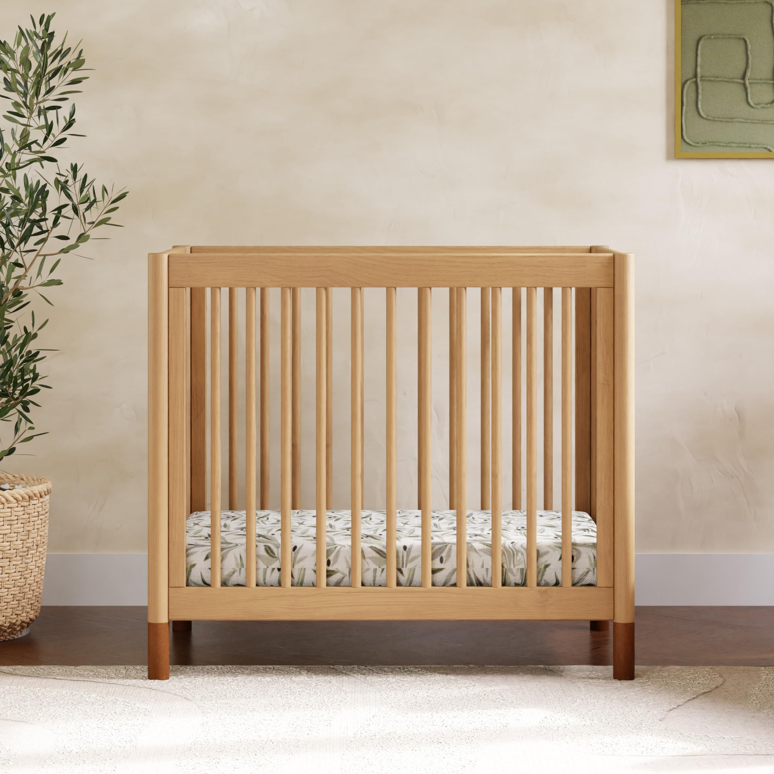 Babyletto Gelato 4-in-1 Convertible Mini Crib - GREENGUARD Gold Certified Wooden Toddler Bed, Daybed & Twin Bed with 4 Adjustable Heights - Space-Saving Nursery Furniture for Small Rooms - Honey Finish with Vegan Tan Leather - Ideal for Newborns, Infants & Toddlers in Apartments or Shared Bedrooms