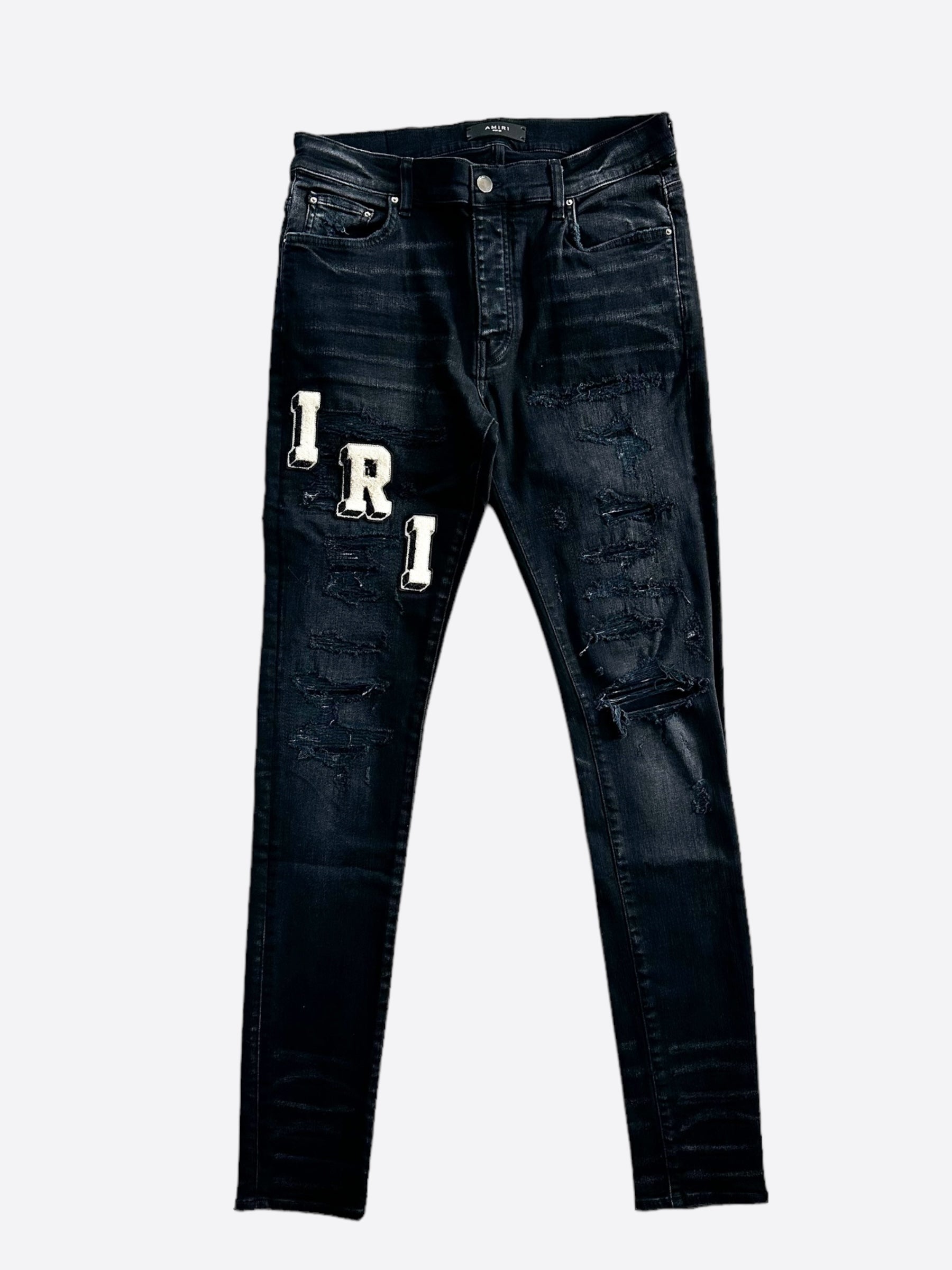 Amiri Faded Black & White Varsity Applique Distressed Jeans for Men - Vintage Style Ripped Denim Pants, Streetwear Fashion, Perfect for Casual Outfits & Night Out