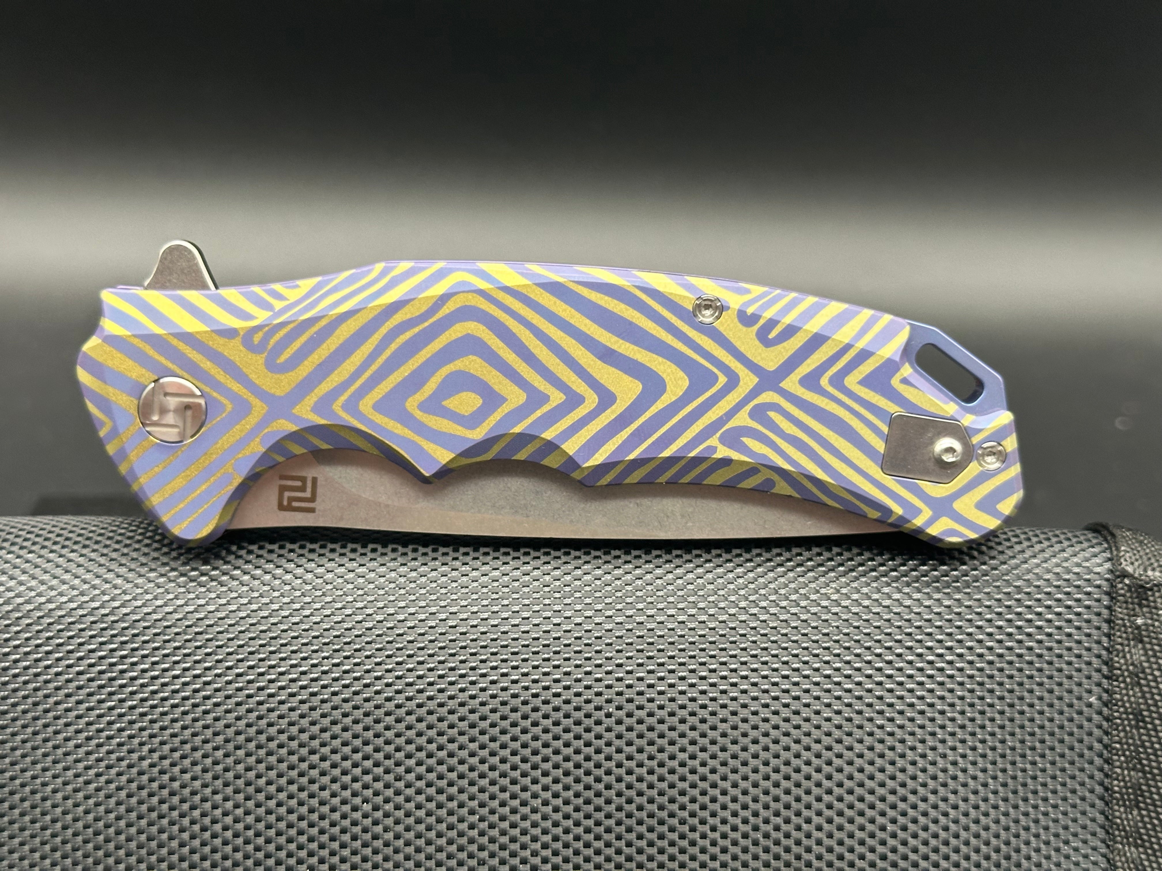 Artisan Cutlery Traditional S35VN Stainless Steel Drop Point Folding Knife with Gold & Blue Anodized Titanium Handle - Perfect for Camping, Hunting, and Everyday Carry (EDC)