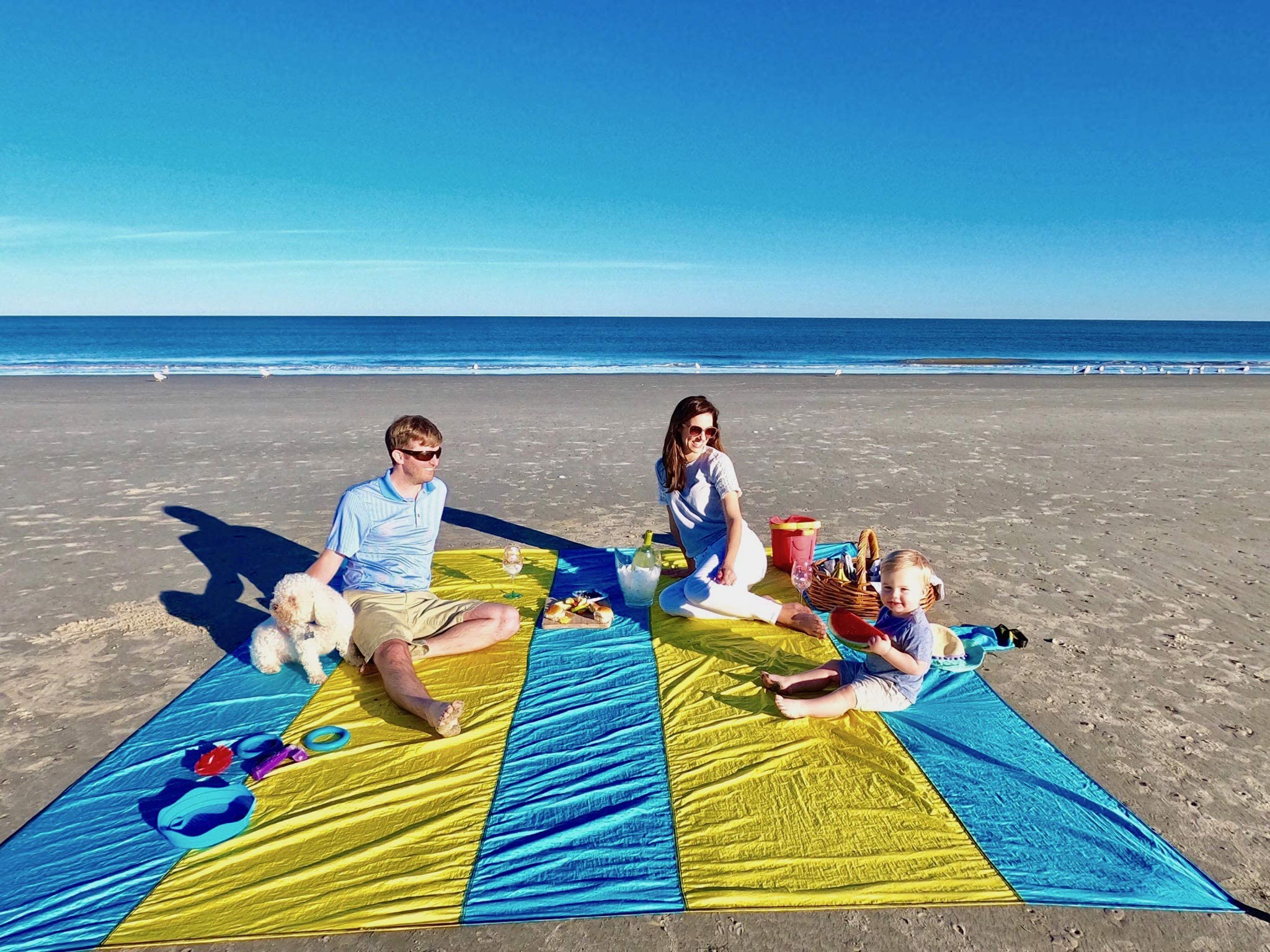 Extra Large 10ft x 9ft Sandproof Waterproof Quick Dry Beach Blanket - Portable Picnic Mat with 4 Metal Stakes & Corner Pockets for 1-8 Adults - Includes Carrying Bag & Secure Clip - Perfect for Beach, Park, Camping and Outdoor Activities