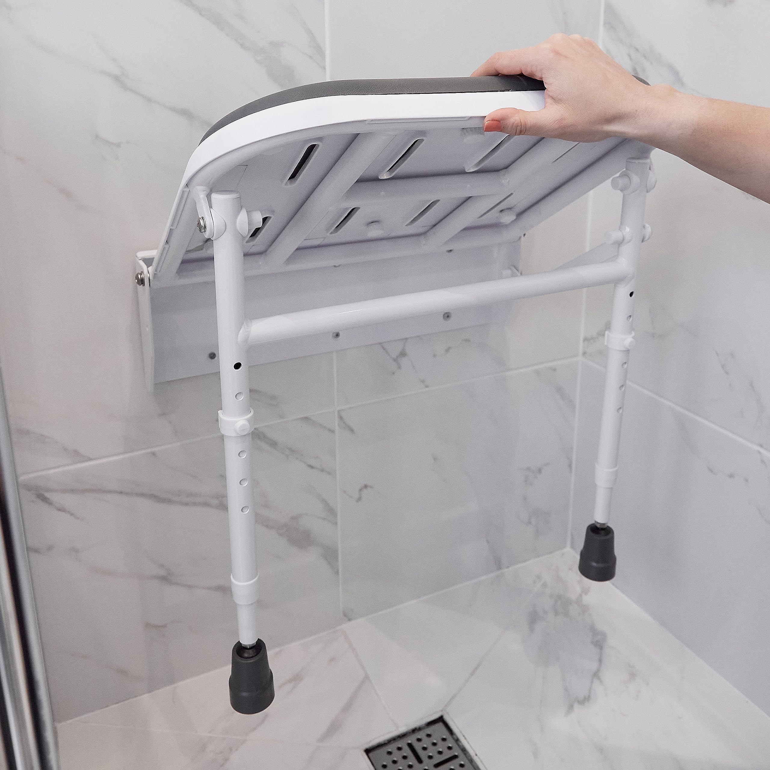 NRS Healthcare Wall Mounted Folding Shower Seat with Padded Seat & Adjustable Legs - Safe Bathroom Shower Chair for Elderly & Disabled - Ideal for Small Spaces & Home Care Use