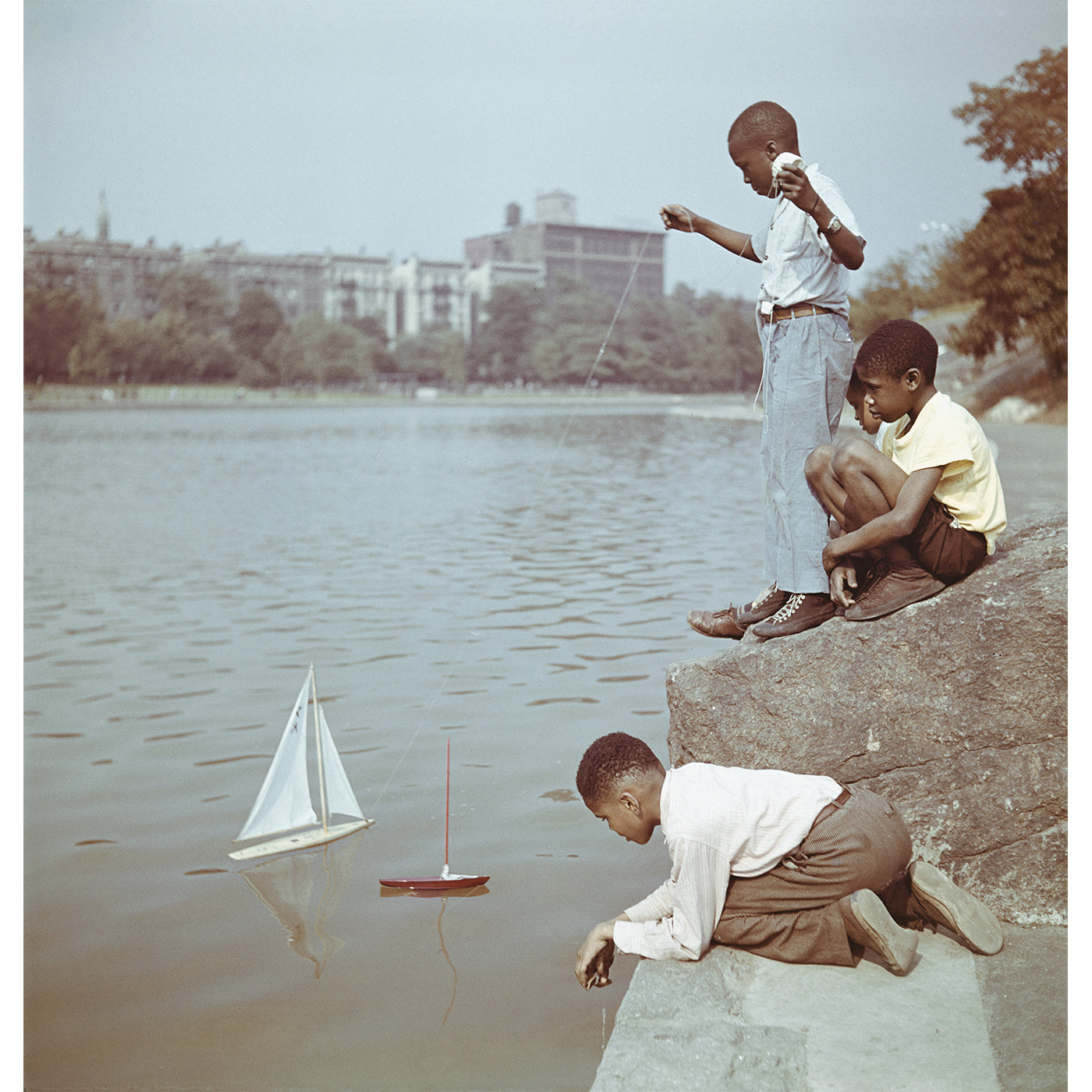 Slim Aarons Model Boat Sailing Photograph - Vintage Nautical Wall Art for Home & Office Decor | Perfect for Beach Houses, Coastal Living Rooms & Yacht Clubs