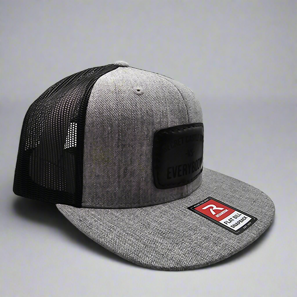 Ash/Black Secret Castle VS Everybody Black Patch Mesh Trucker Cap - Stylish Adjustable Hat for Men & Women, Perfect for Outdoor Activities, Concerts, and Streetwear Fashion