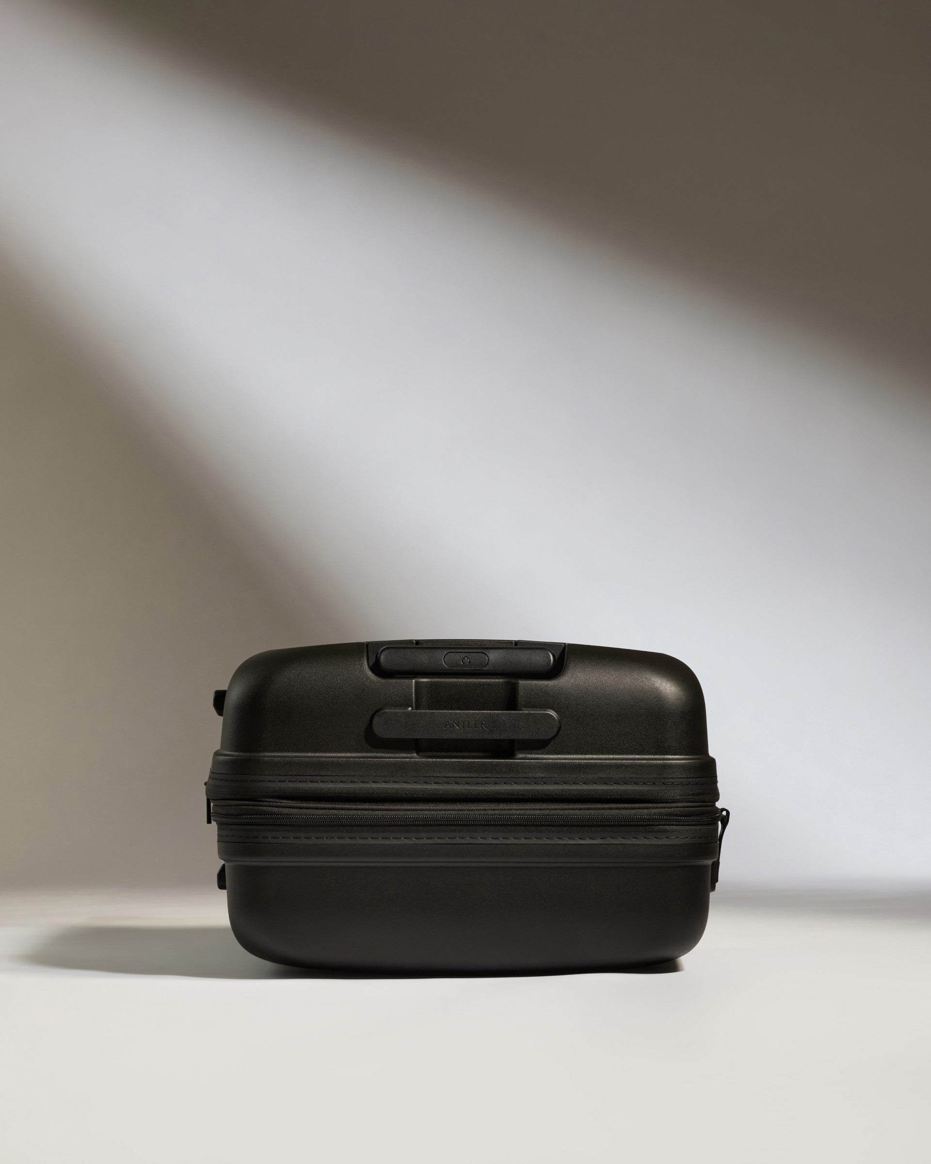 Medium Black Luggage with Single Stripe - Perfect for Business Travel & Weekend Getaways
