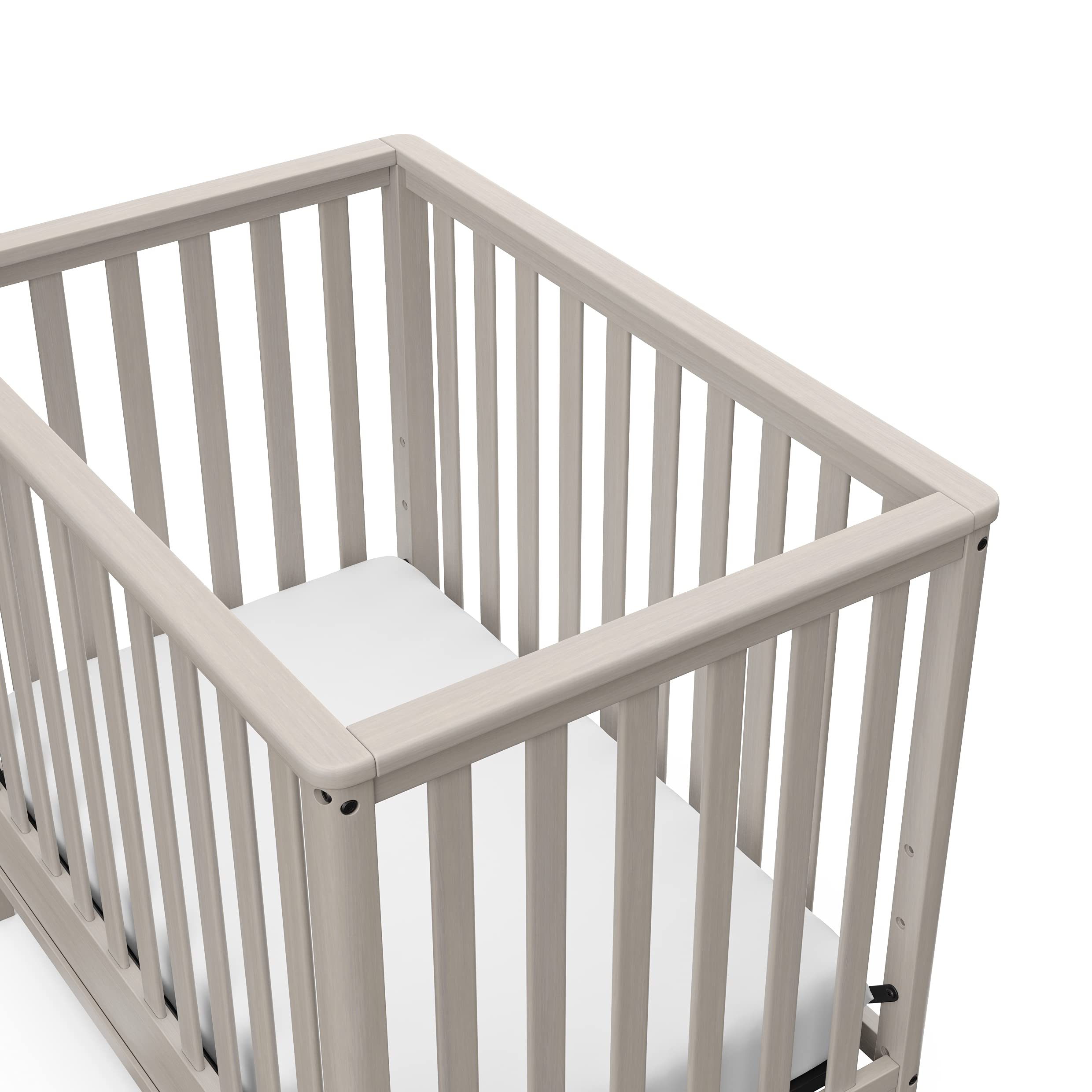 Storkcraft 5-in-1 Convertible Mini Crib with Bonus 2.75