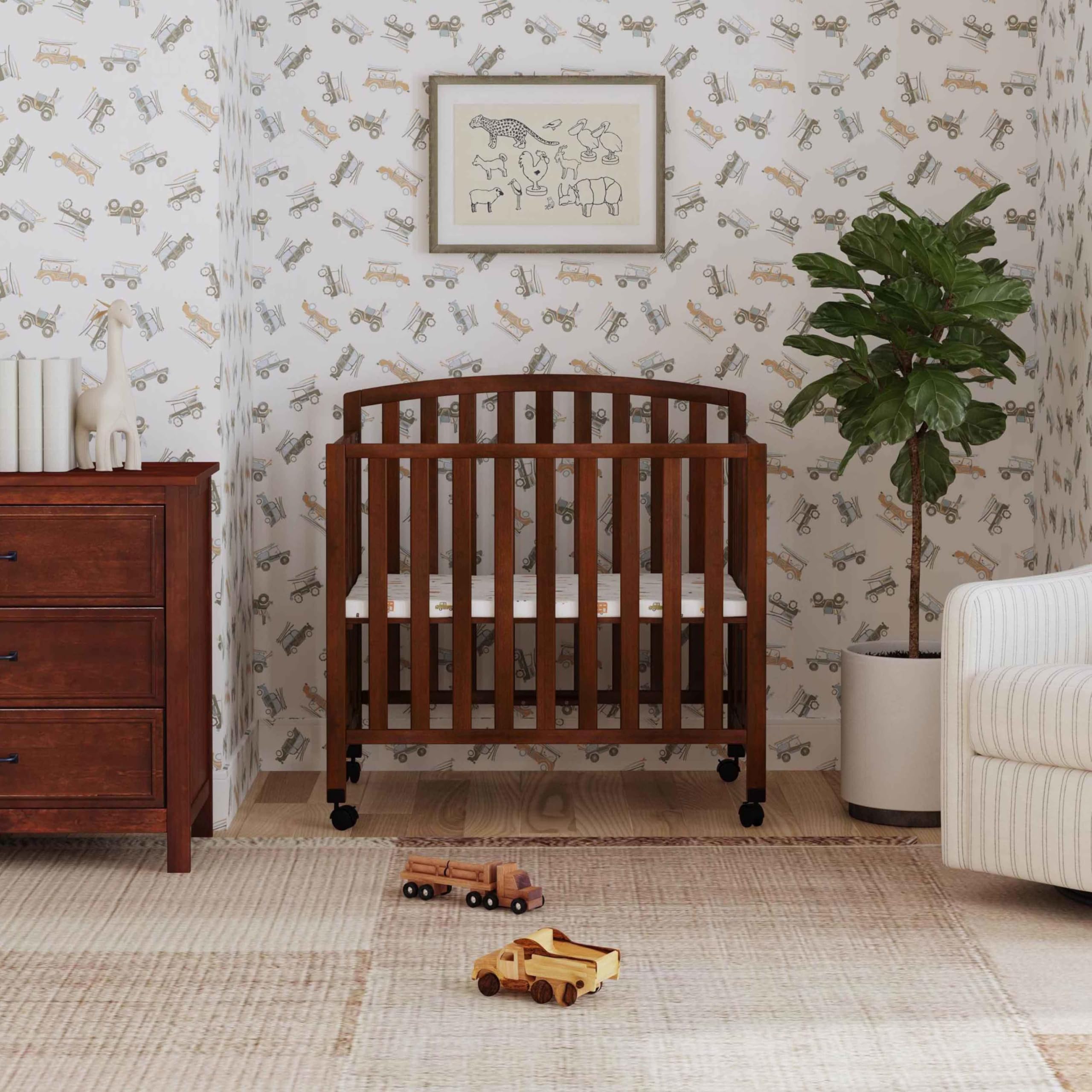 DaVinci Dylan 3-in-1 Portable Baby Crib with Wheels - Convertible Toddler Bed & Daybed - GREENGUARD Gold Certified Safe Nursery Furniture - 4 Adjustable Mattress Heights - Compact Design for Small Spaces - Easy Assembly - Espresso Finish - Ideal for Nursery, Bedroom, or Travel Use