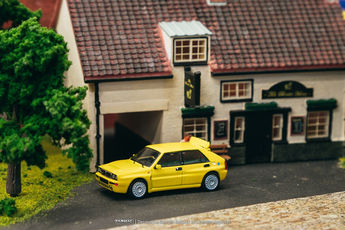 Tarmac Works 1:64 Scale Lancia Delta HF Integrale Diecast Model Car - Giallo Ginestra Yellow | Collectible Miniature Vehicle for Display, Racing Enthusiasts & Diecast Collectors