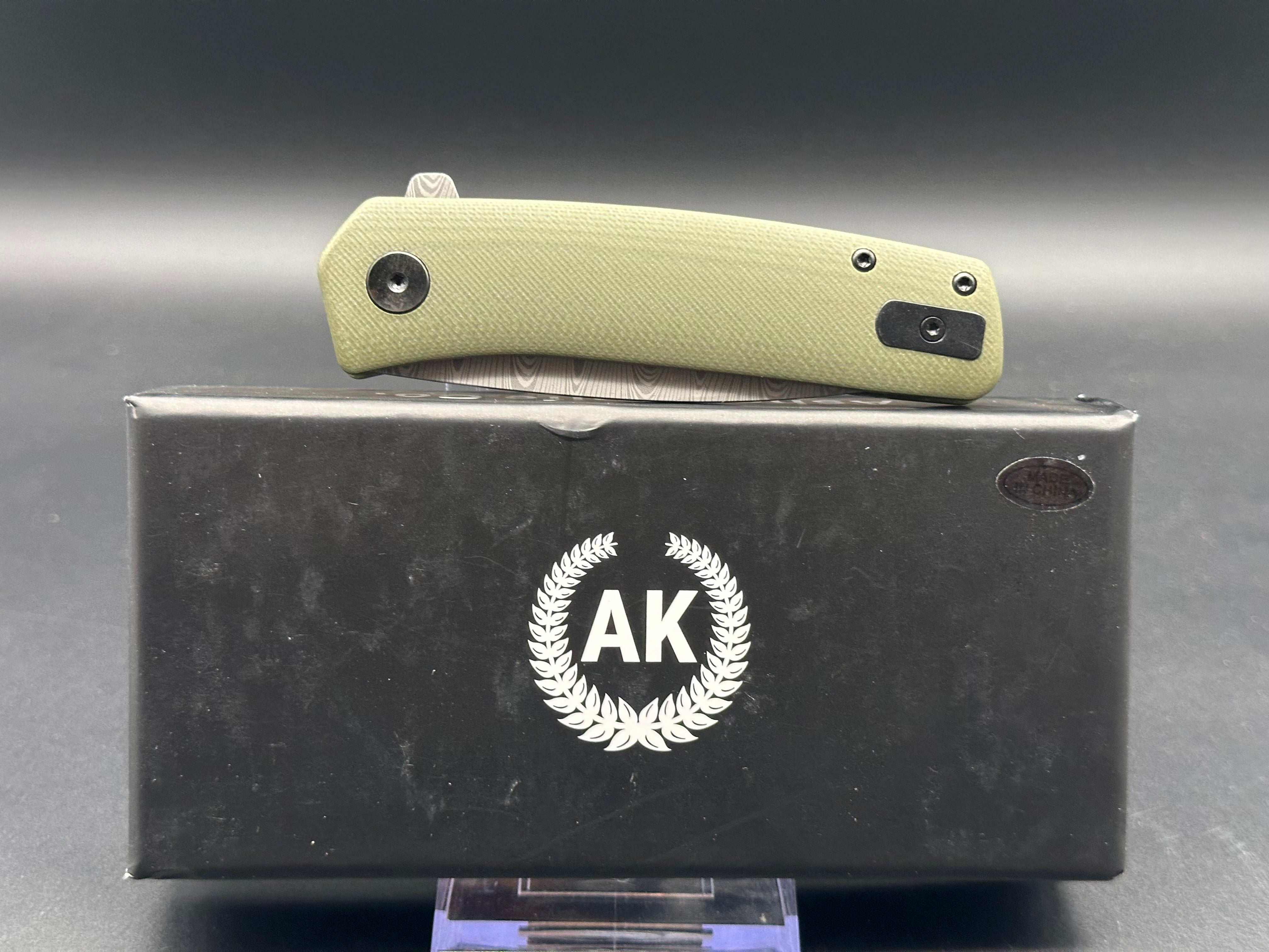 Asher Knives The Spiro Flipper Folding Pocket Knife - OD Green G10 Handle, S35VN Steel Blade, Laser Ladder Damascus Pattern - EDC, Outdoor, Camping, Survival Gear
