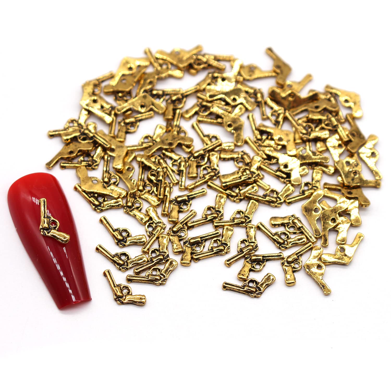 WOKOTO 100pcs Antique Gold Gun Charms for Nail Art - 3D Nail Jewelry for Women, Punk Style Nail Decorations - Perfect for Acrylic Nails, Manicures, and Creative Nail Designs | Great for Parties, Halloween, and Themed Nail Art