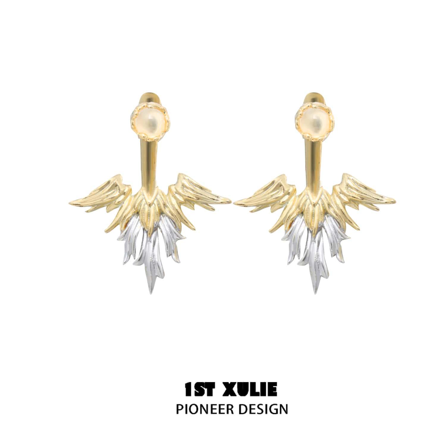 A pair of gold earrings
