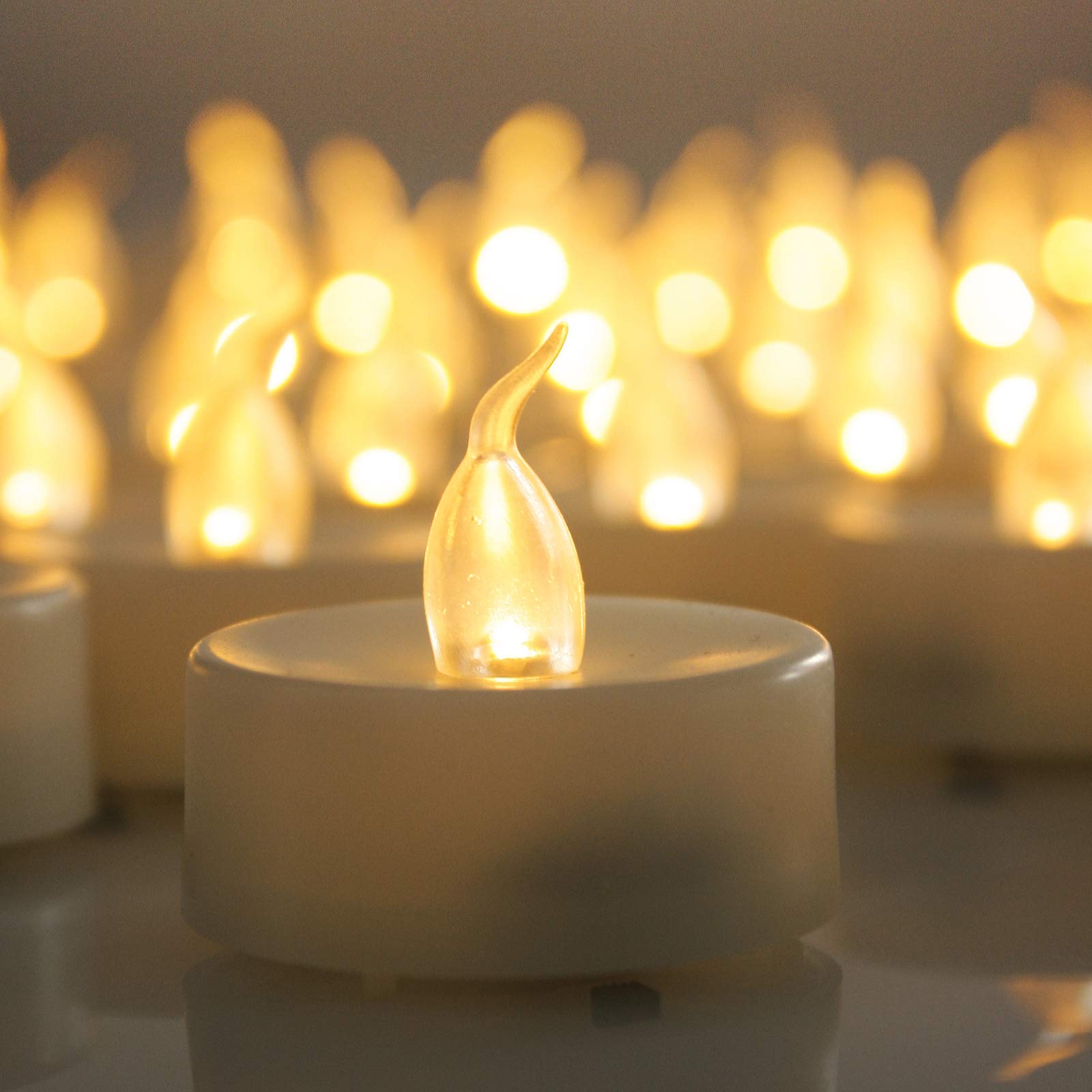 Battery Operated Flameless LED Tea Lights - Realistic Flickering Electric Candles (12 Pack) for Wedding, Party, Halloween & Christmas Decor - Perfect for Table Centerpieces, Votives & Home Ambiance