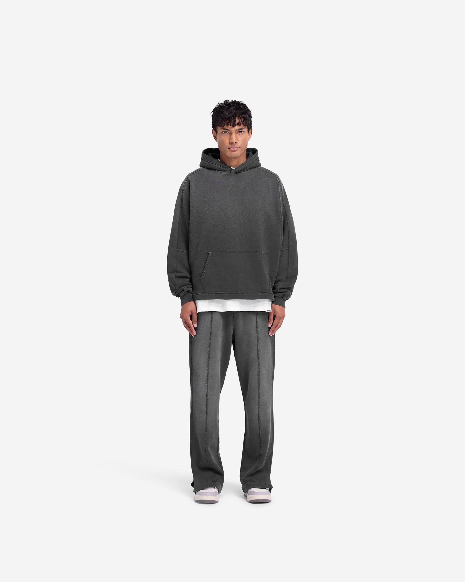 Distressed Black Stepped Hem Hoodie for Men & Women - Trendy Oversized Pullover for Streetwear & Casual Outfits