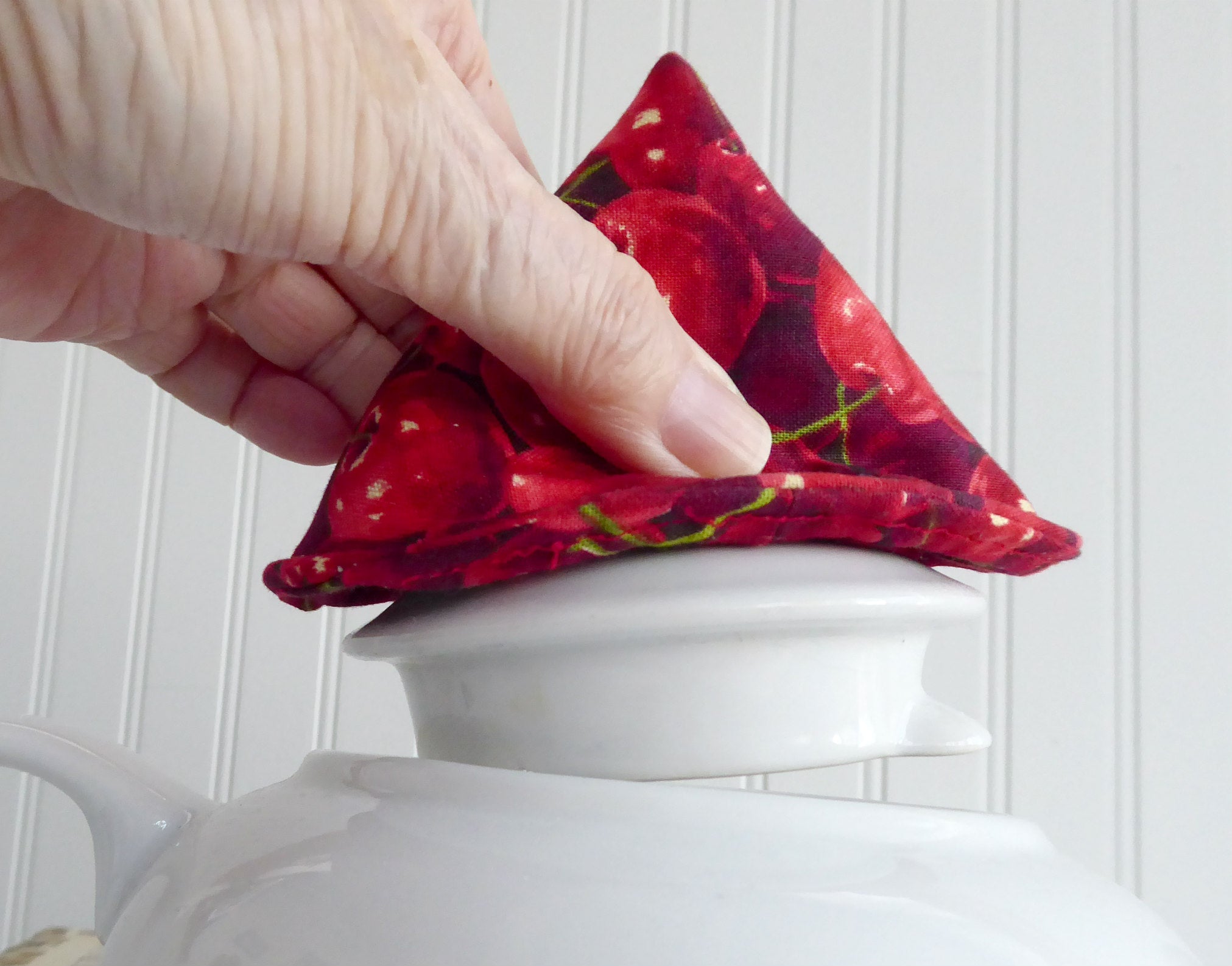 Red Cherries Knob Holder - Teapot Lid Holder with Soft Padded Interior & Exterior - Perfect for Kitchen, Tea Parties, and Gift Giving